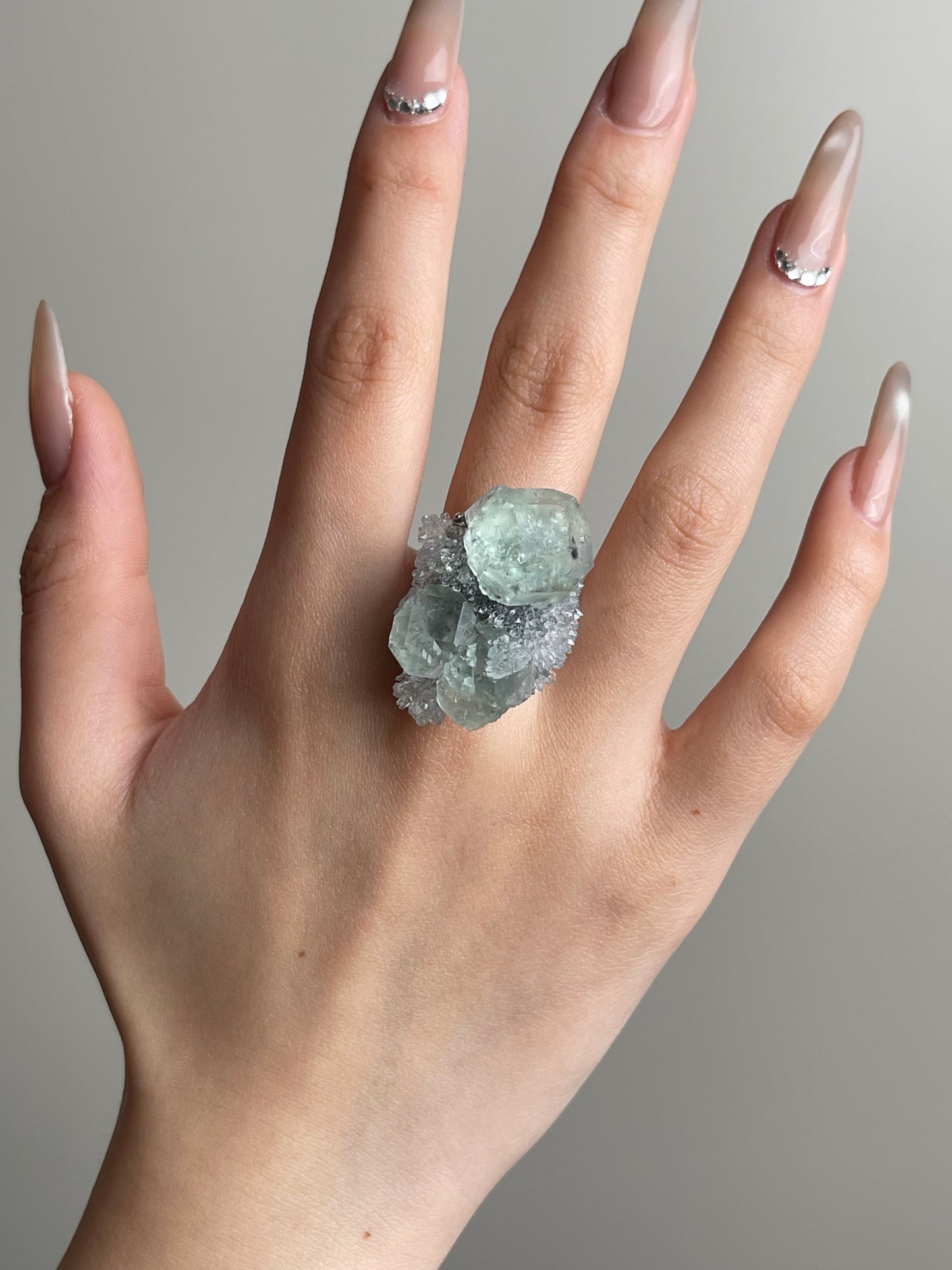 Green fluorite with quartz mineral specimen ring worn on hand