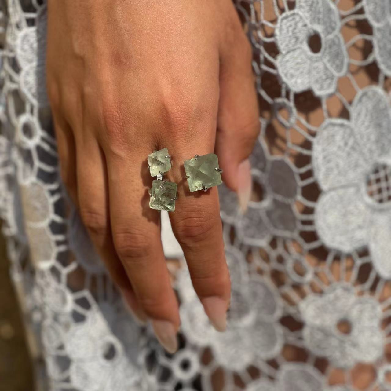 octahedral fluorite ring close up on hand green crystal