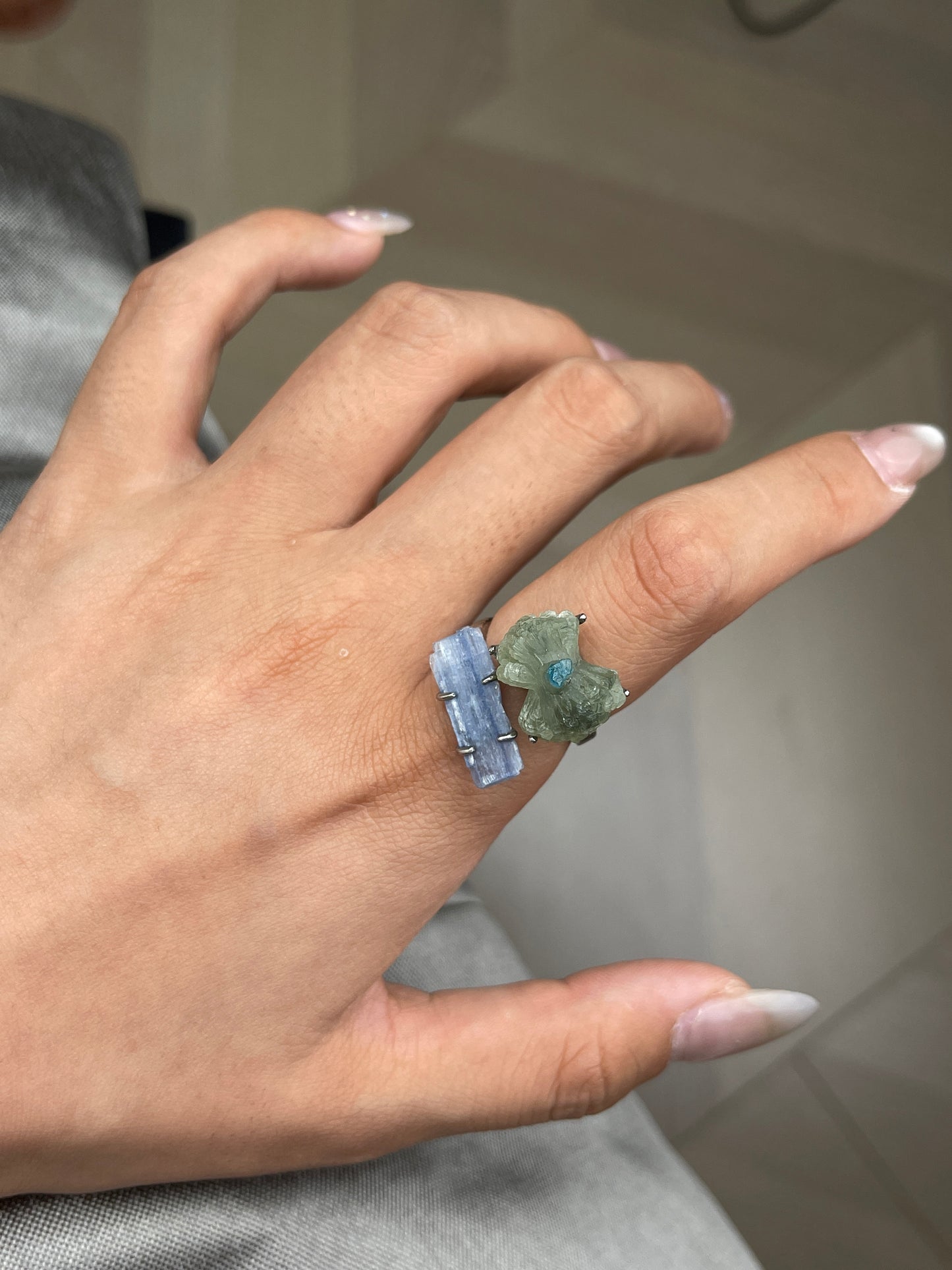 Close-up hand shot of Green Prehnite Blue Apatite and Kyanite bow ring