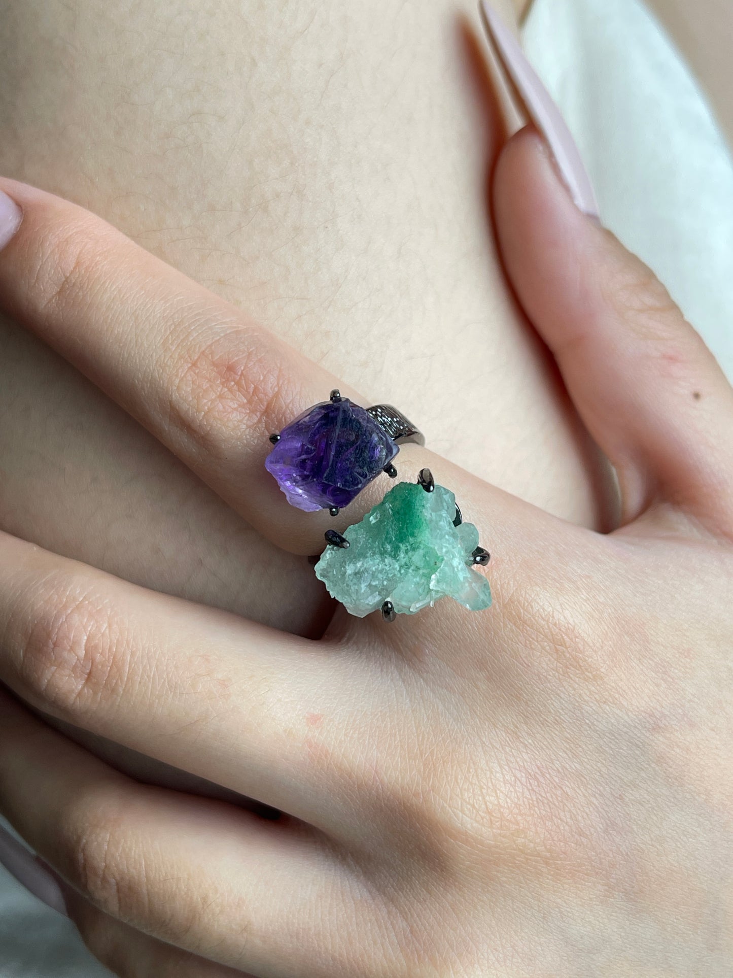 Close-up hand view of raw Green Strawberry Quartz and Amethyst crystal ring