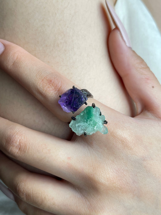 Close-up hand view of raw Green Strawberry Quartz and Amethyst crystal ring