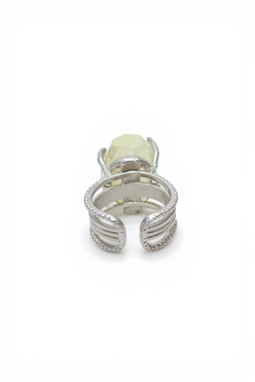 Back view of hand-cut citrine ring showing adjustable open band and silver tone setting