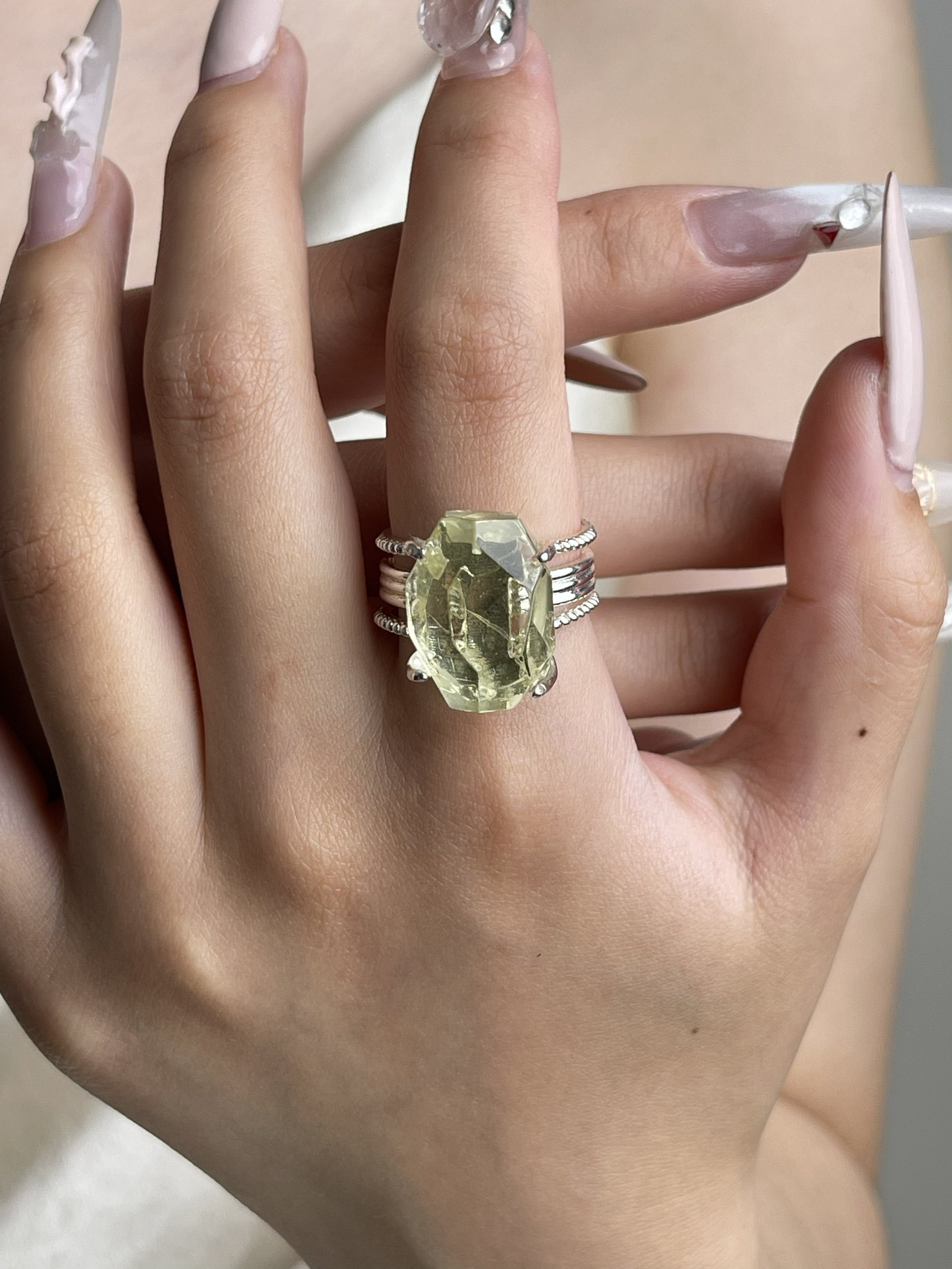Hand-cut Brazilian citrine ring worn on hand with warm golden quartz centerpiece