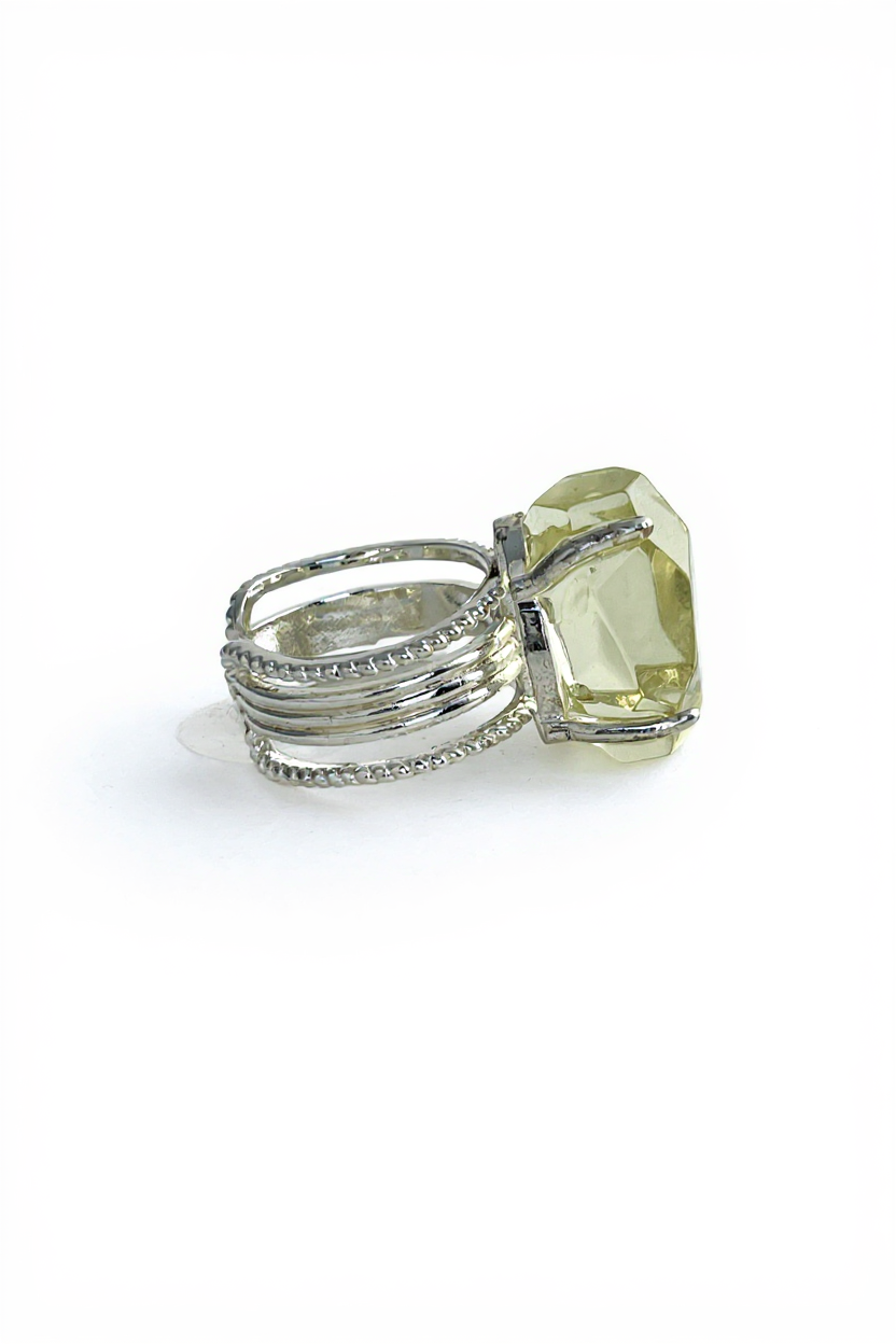 Side view of hand-cut citrine ring with freeform yellow quartz and silver tone setting