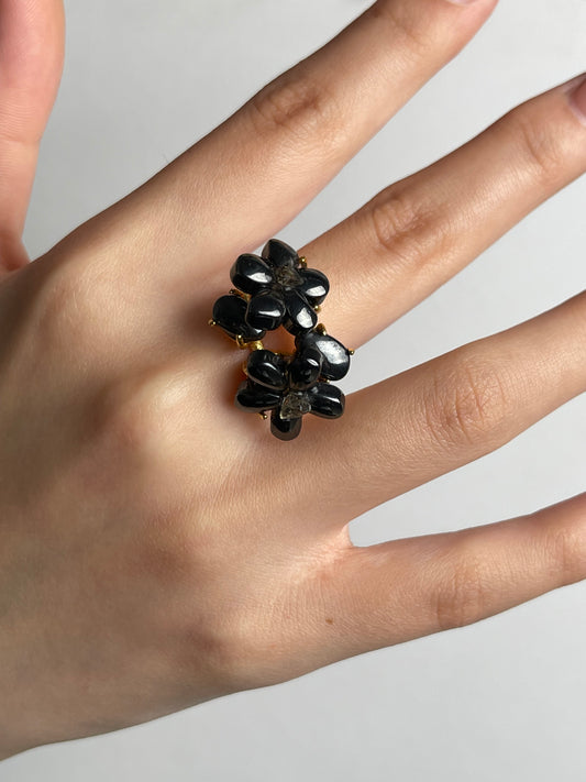 macro view hematite blossom ring with herkimer diamond quartz