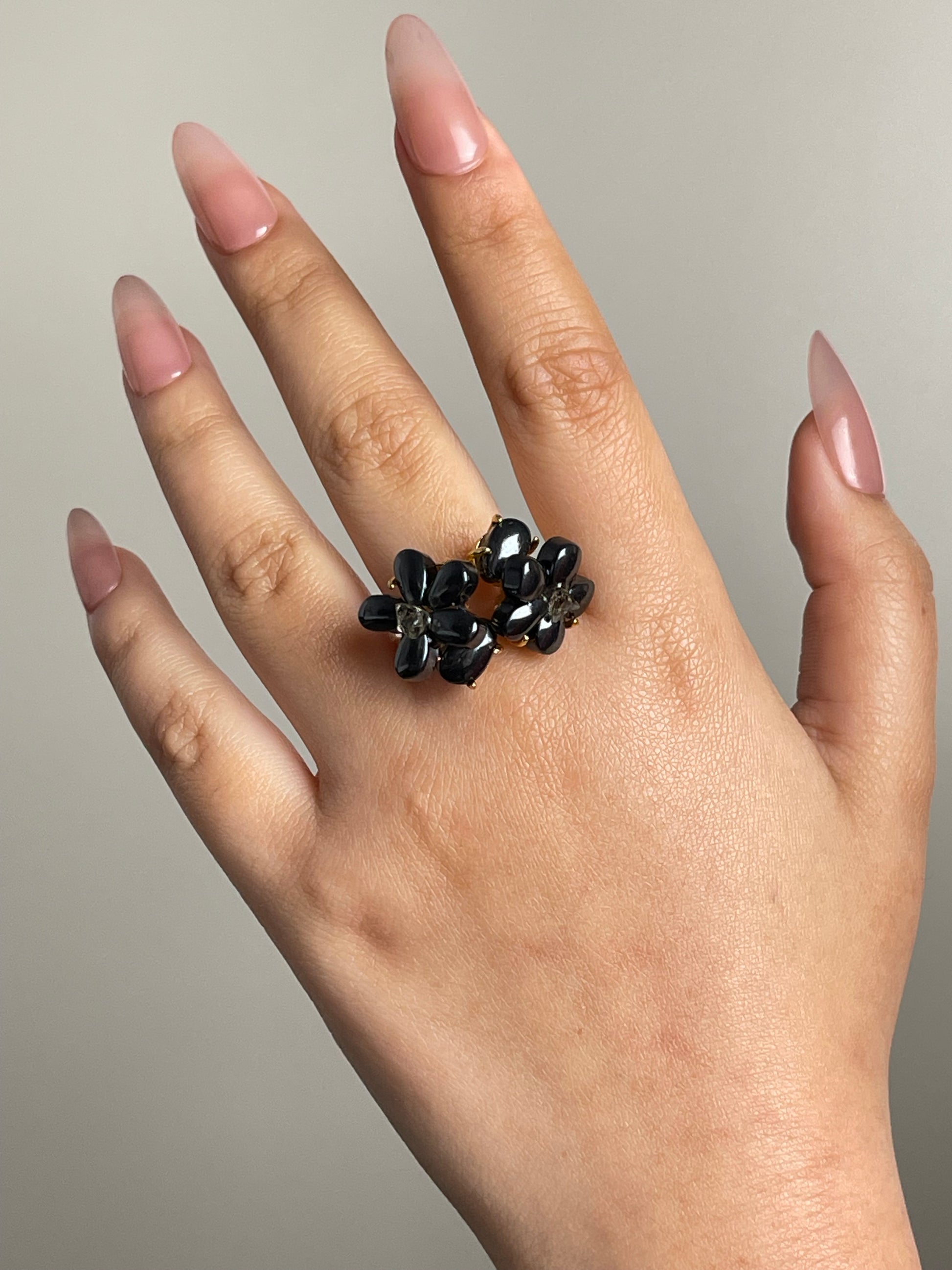 hematite crystal blossom ring worn on hand