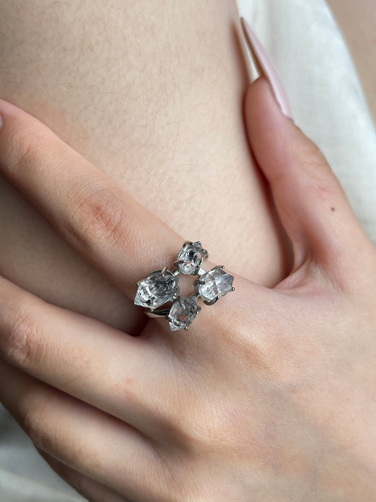Close-up hand view of Herkimer Diamond Quartz four stone ring