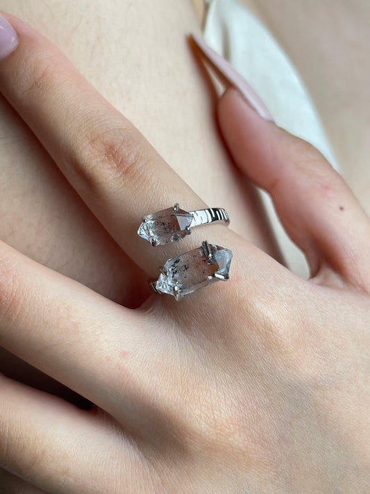 Close-up hand view of Herkimer Diamond Quartz twin stone ring