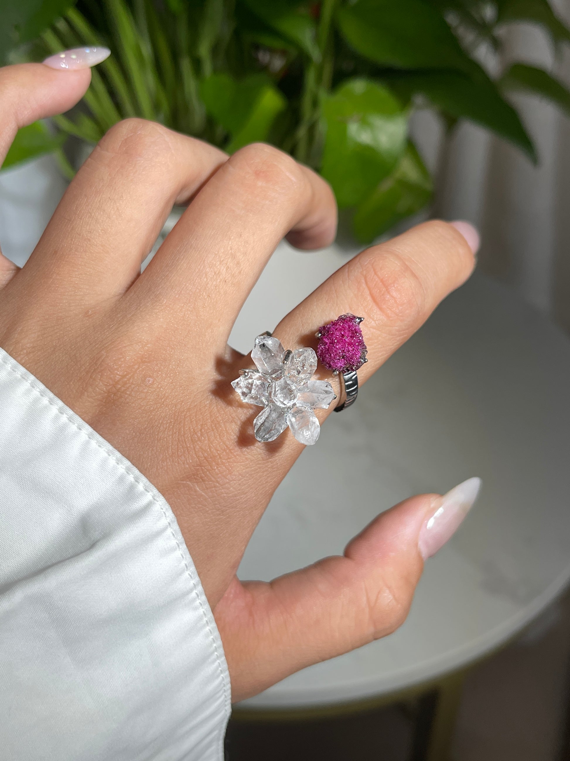 Close up of Herkimer Diamond Quartz and ruby ring on hand
