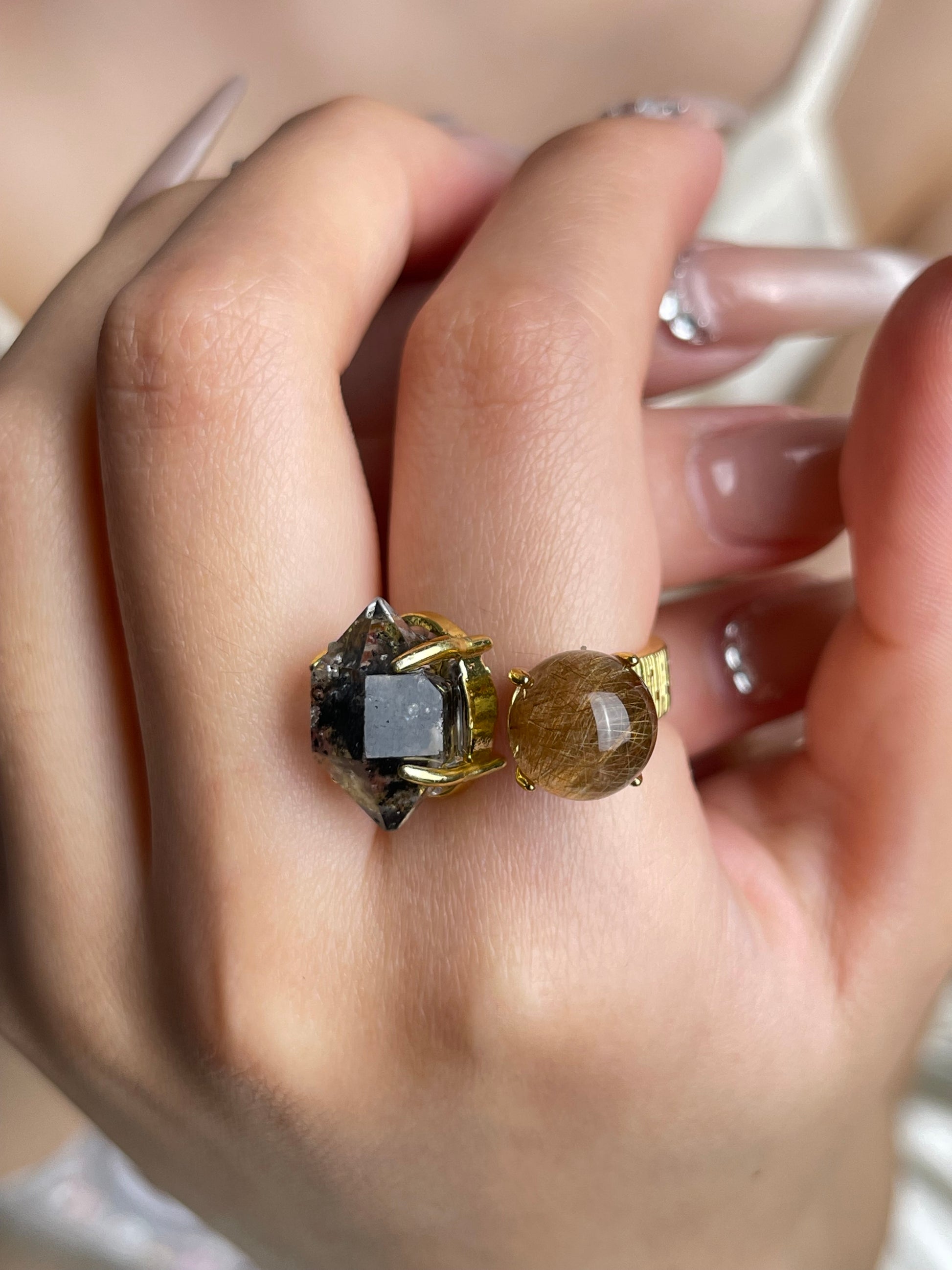 Close-up hand shot of Herkimer Diamond Quartz and Rutilated Quartz Ring by Oryssia