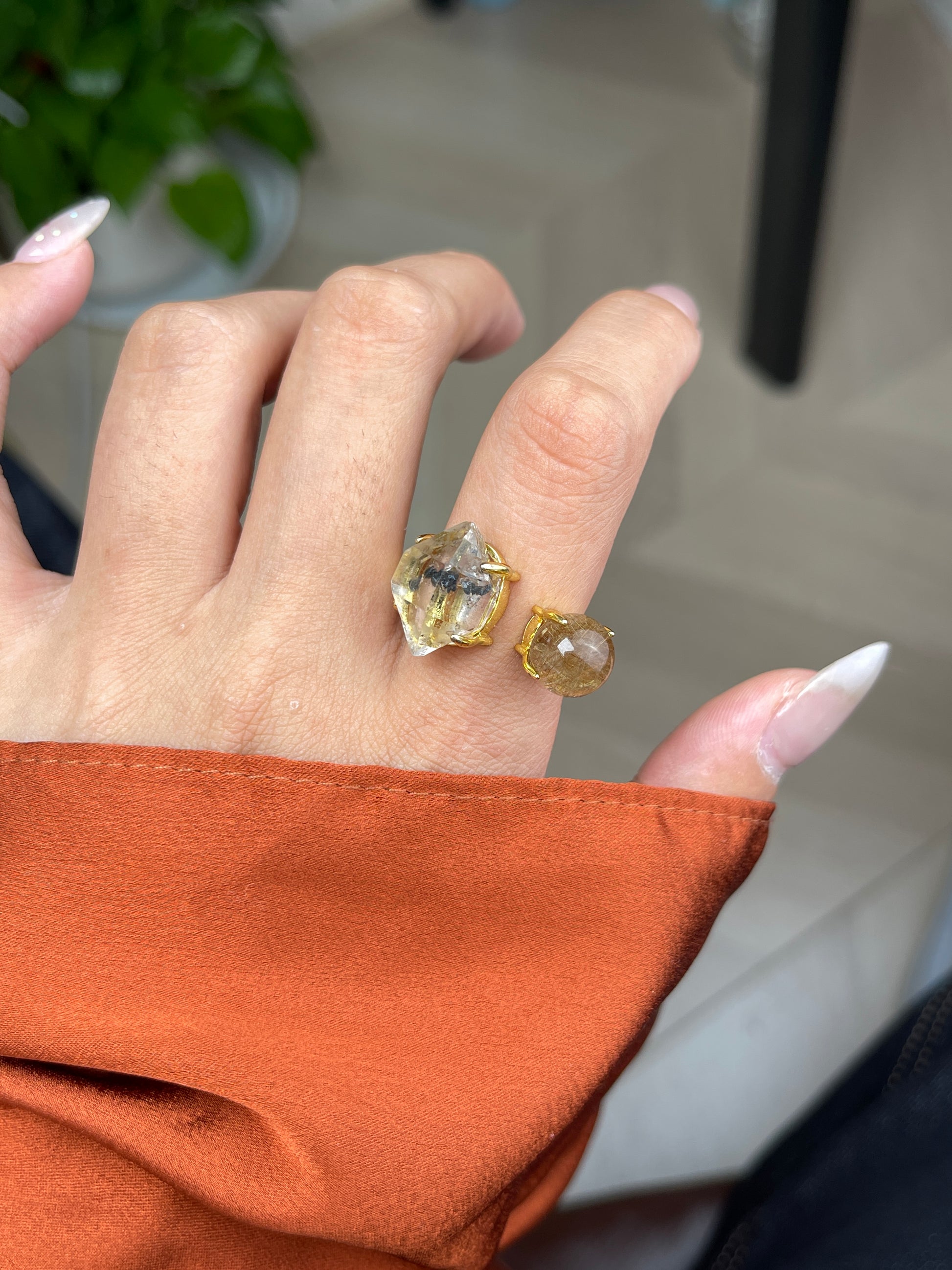 Close-up hand shot of Herkimer Diamond Quartz and Rutilated Quartz Ring by Oryssia