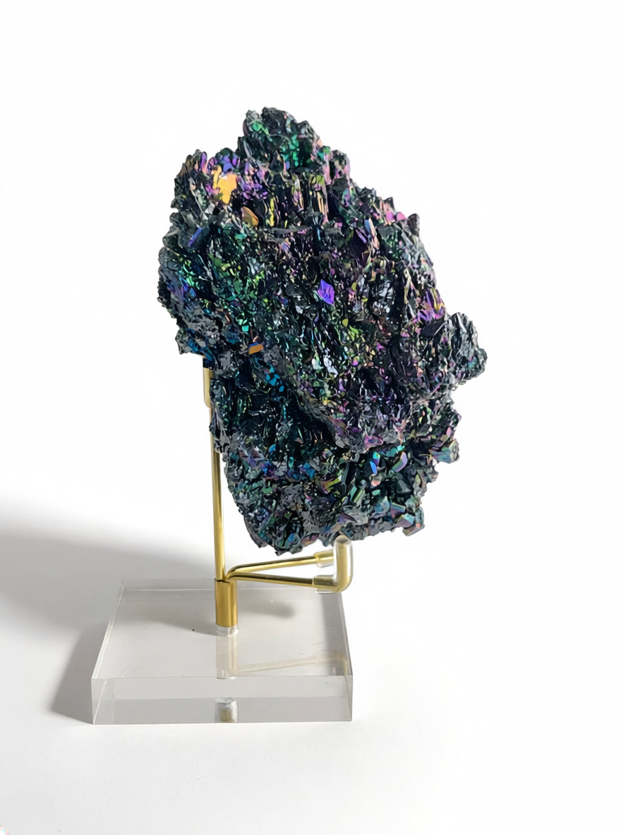side view of carborundum crystal specimen showing angular layered structure and iridescent colors