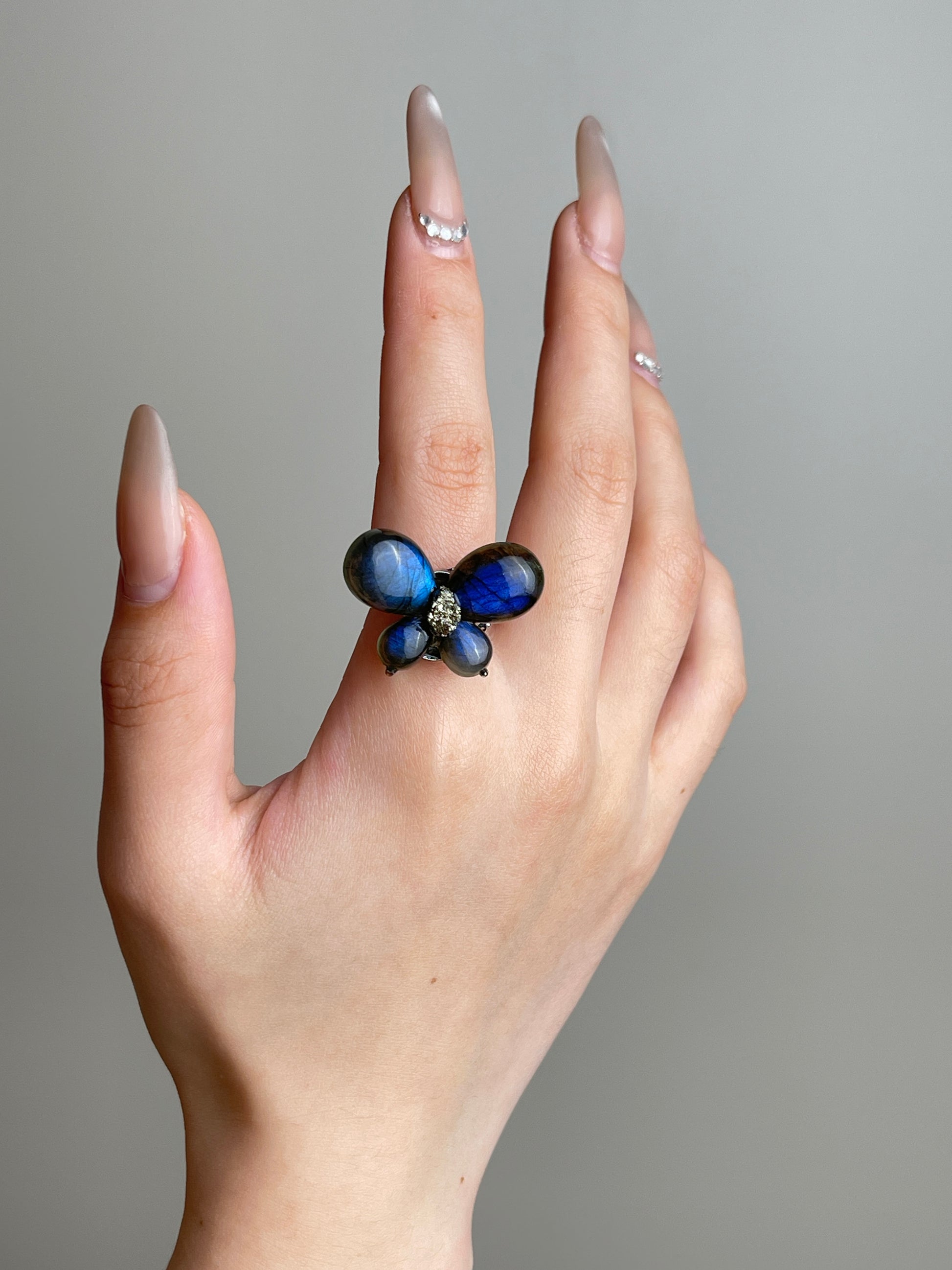 Hand view of Labradorite Butterfly Ring with raw Chalcopyrite