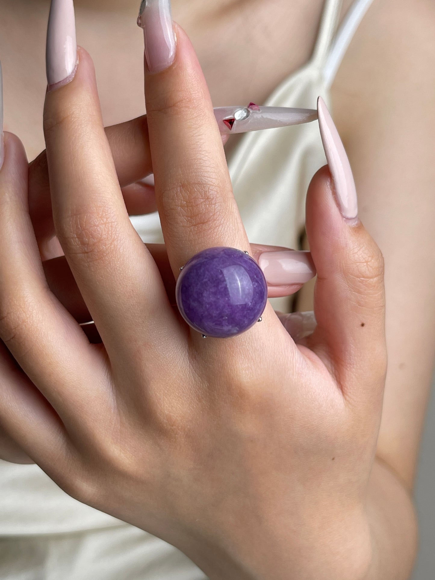 Lilac Lepidolite dome ring worn on hand