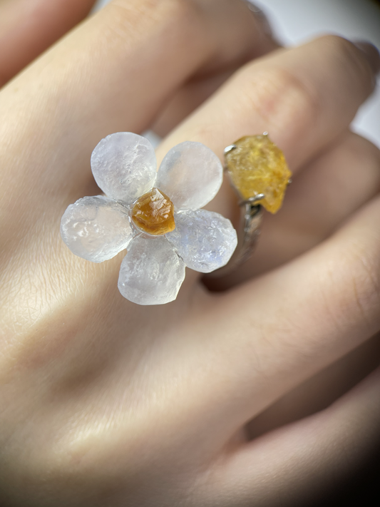 Close-up of Moonstone flower and Citrine two stone ring worn on hand