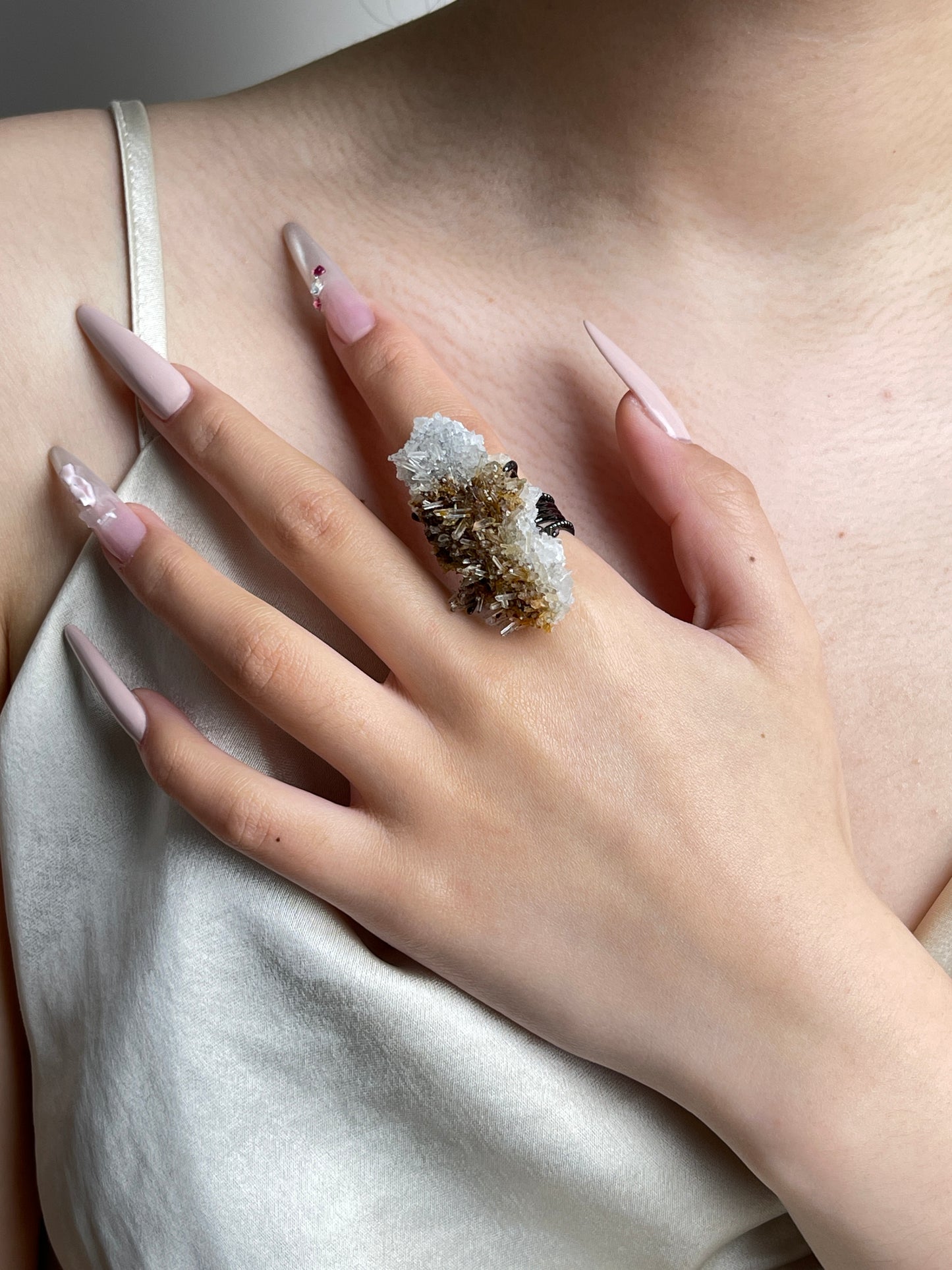 Needle Quartz Cluster mineral specimen ring worn on hand