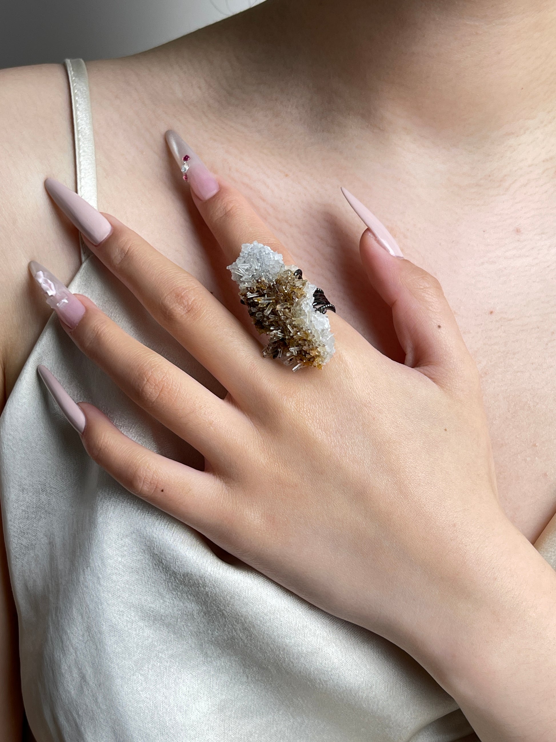 Needle Quartz Cluster mineral specimen ring worn on hand