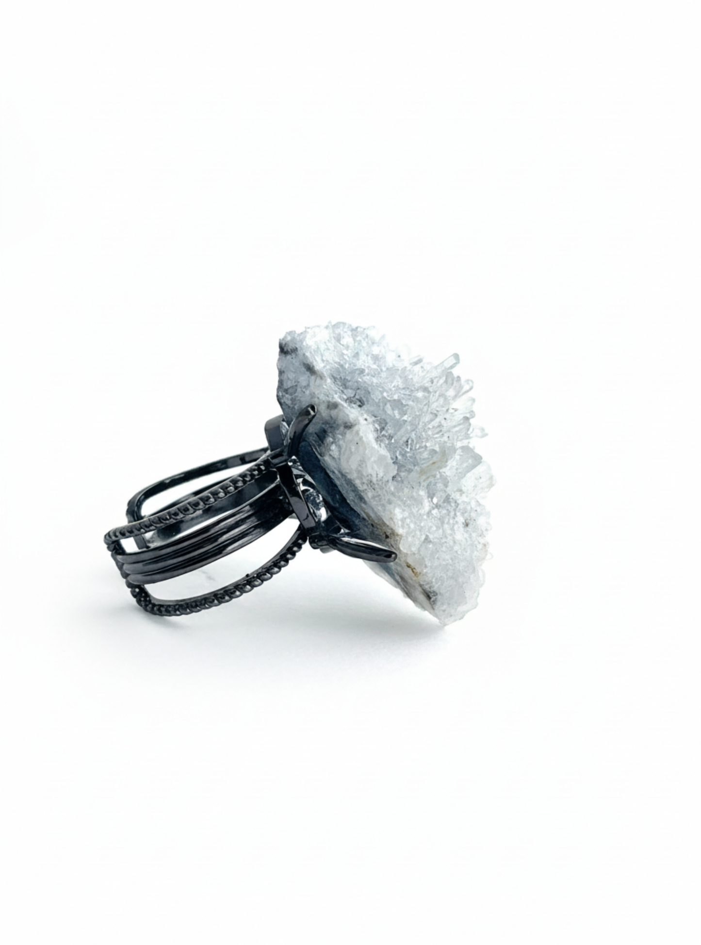 Side view of Needle Quartz crystal cluster ring on adjustable band