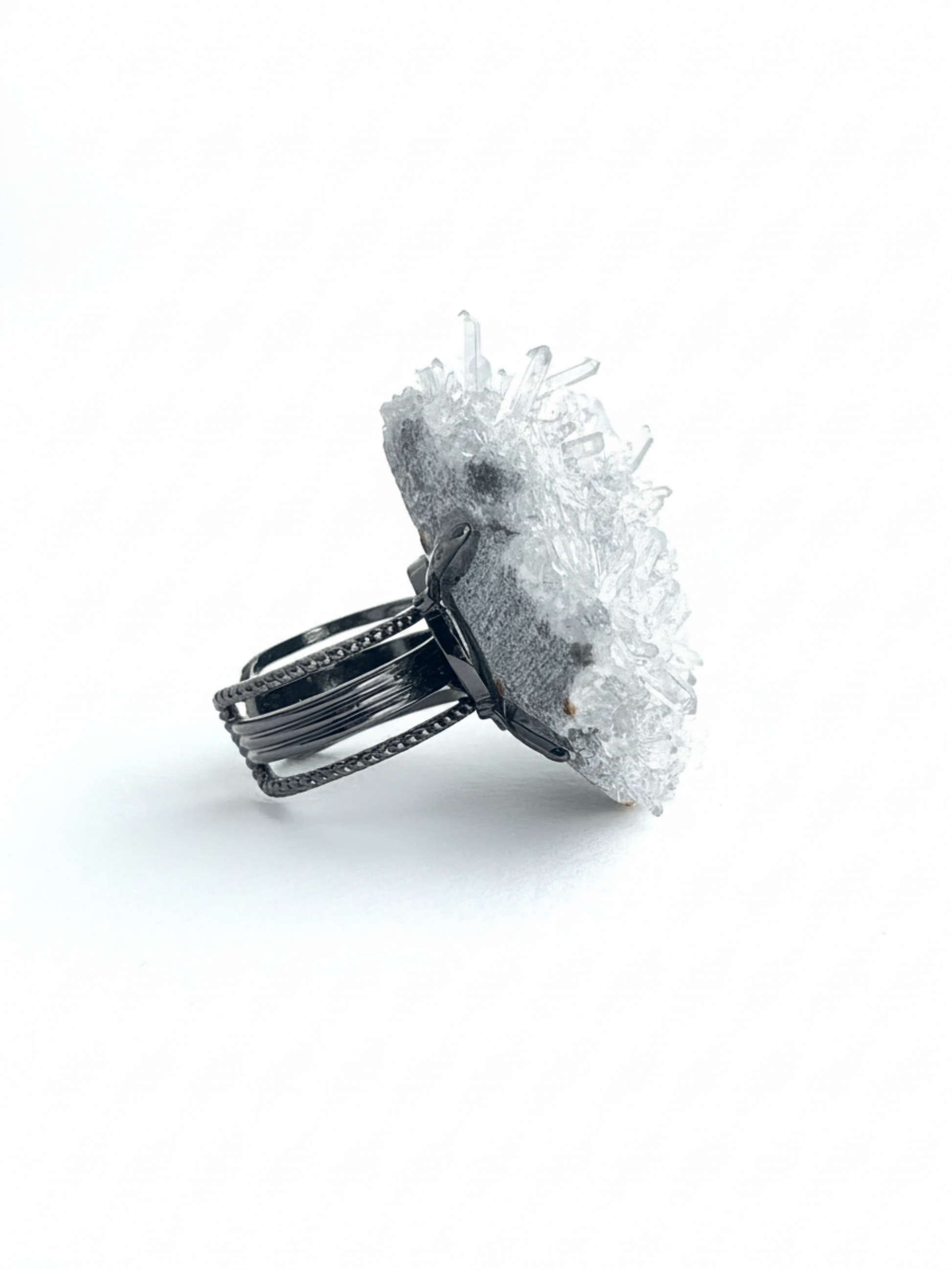 Side view of Needle Quartz crystal cluster ring on adjustable band
