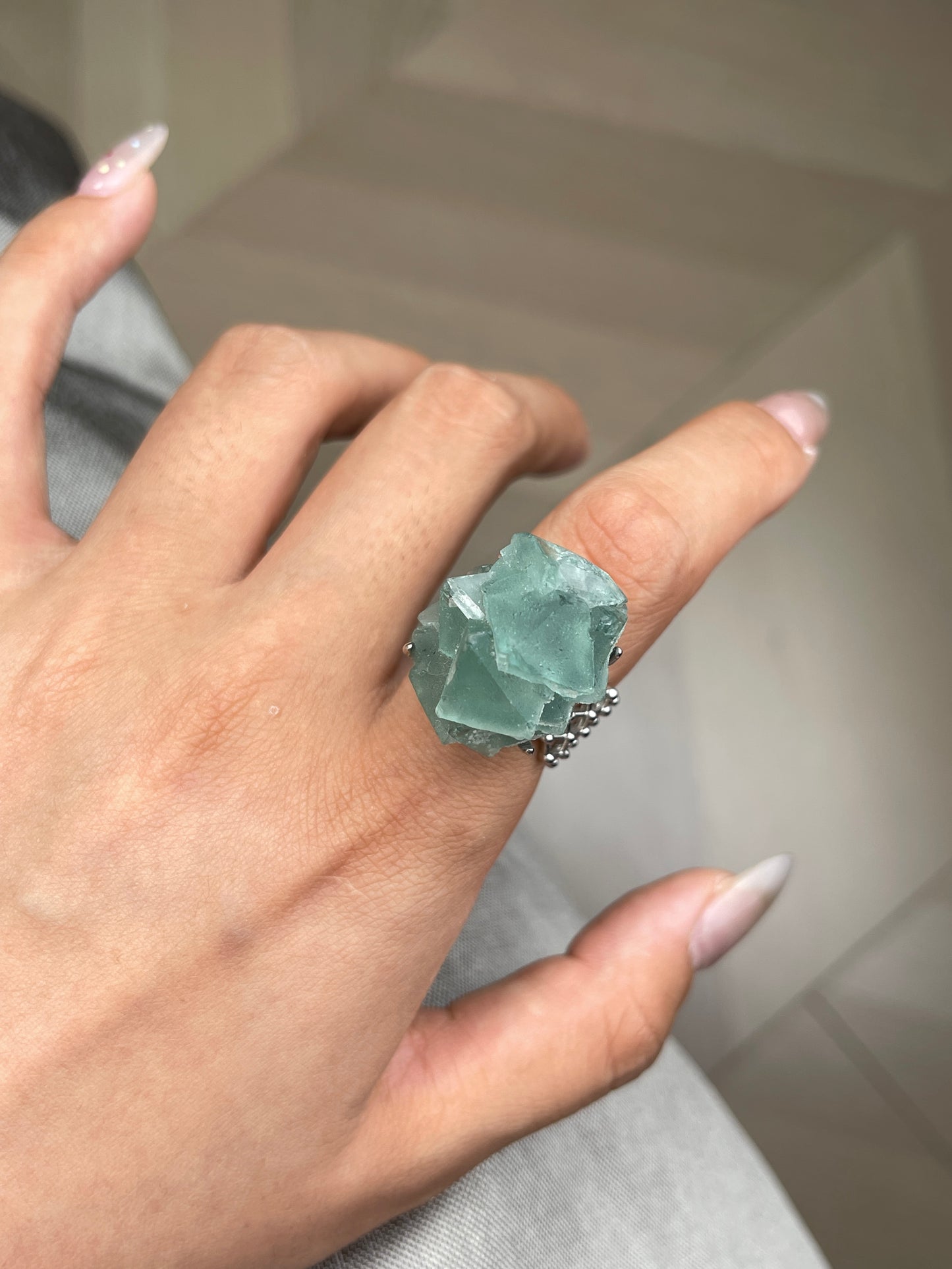 close up natural octahedral green fluorite crystal ring