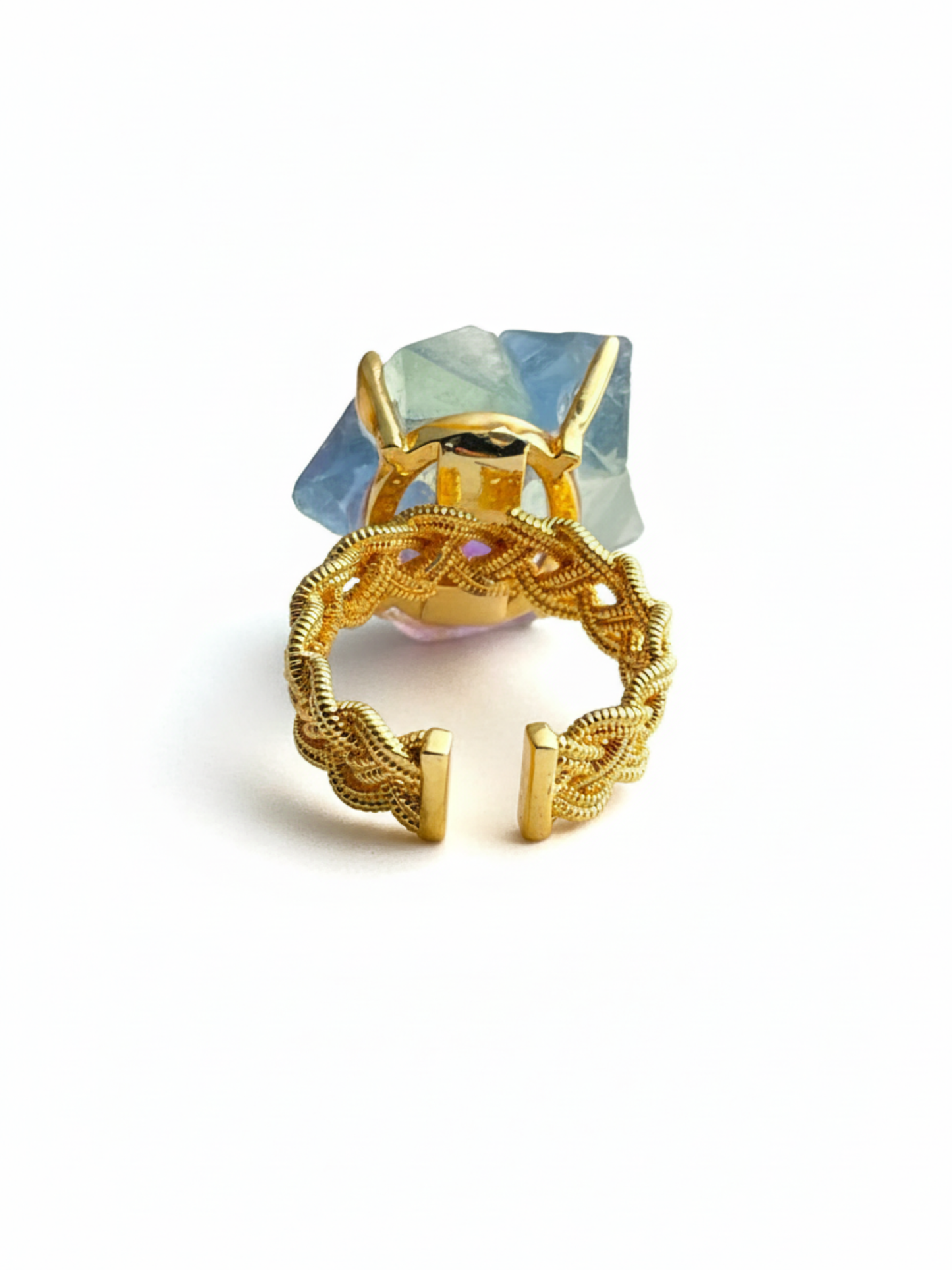 Back view of octahedral fluorite flower ring with peridot center and open band design