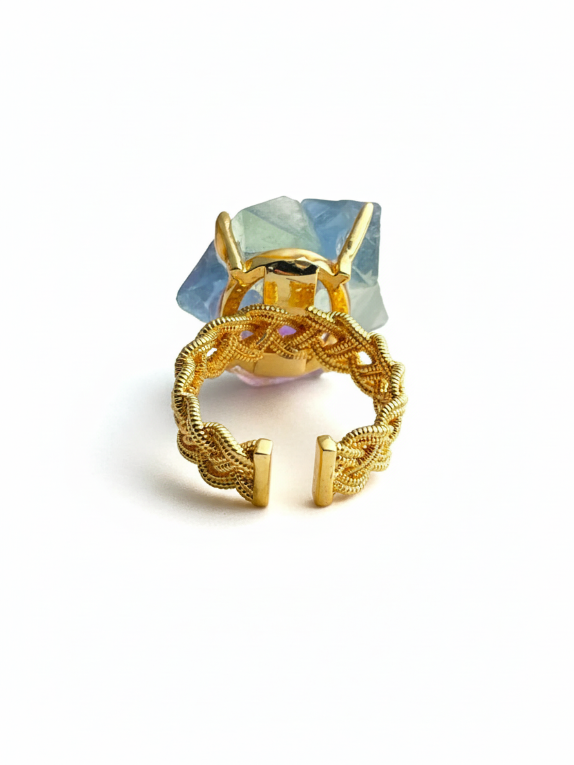 Back view of octahedral fluorite flower ring with peridot center and open band design