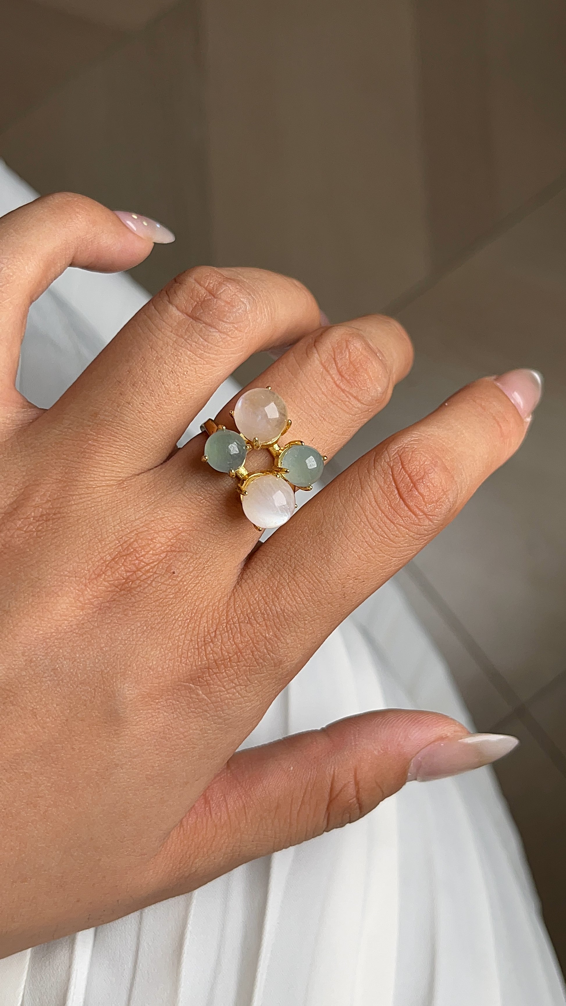 Close-up aquamarine and moonstone gemstone ring
