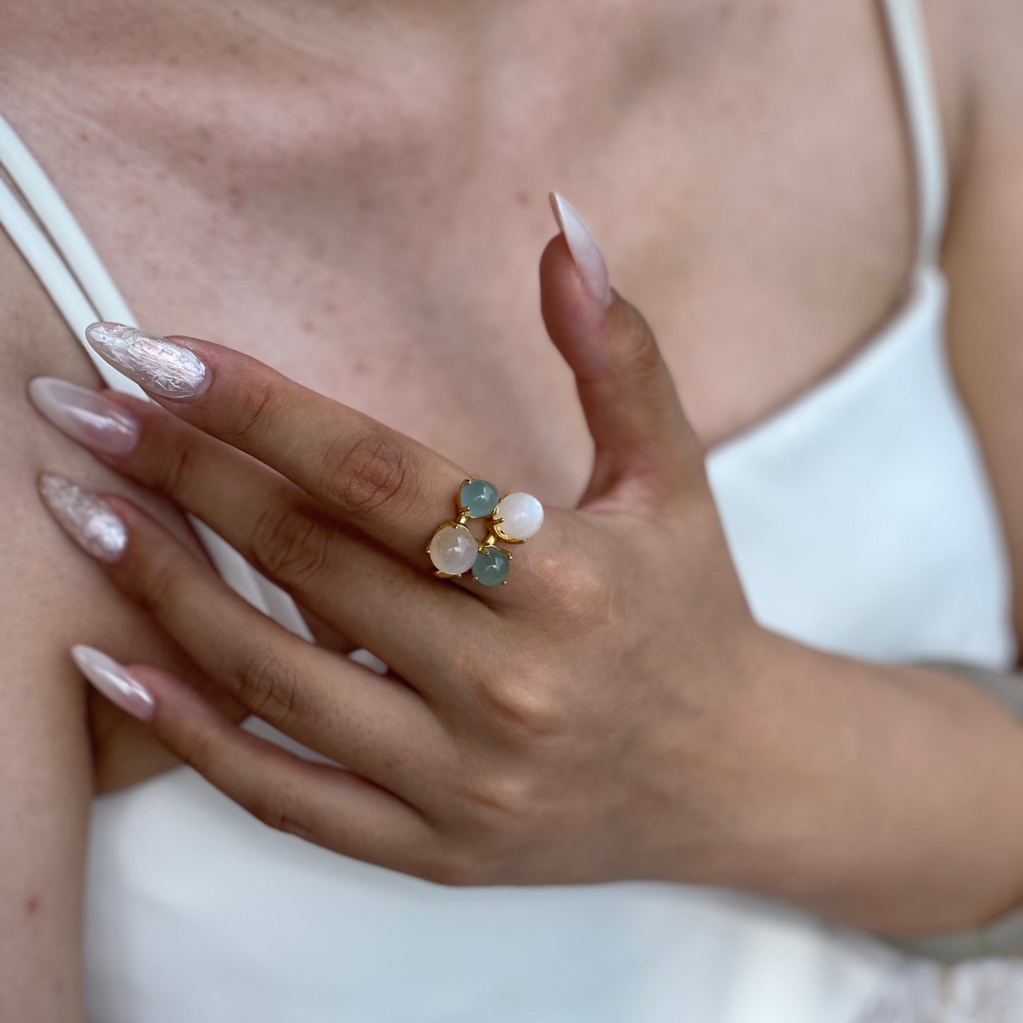 Close-up aquamarine and moonstone gemstone ring