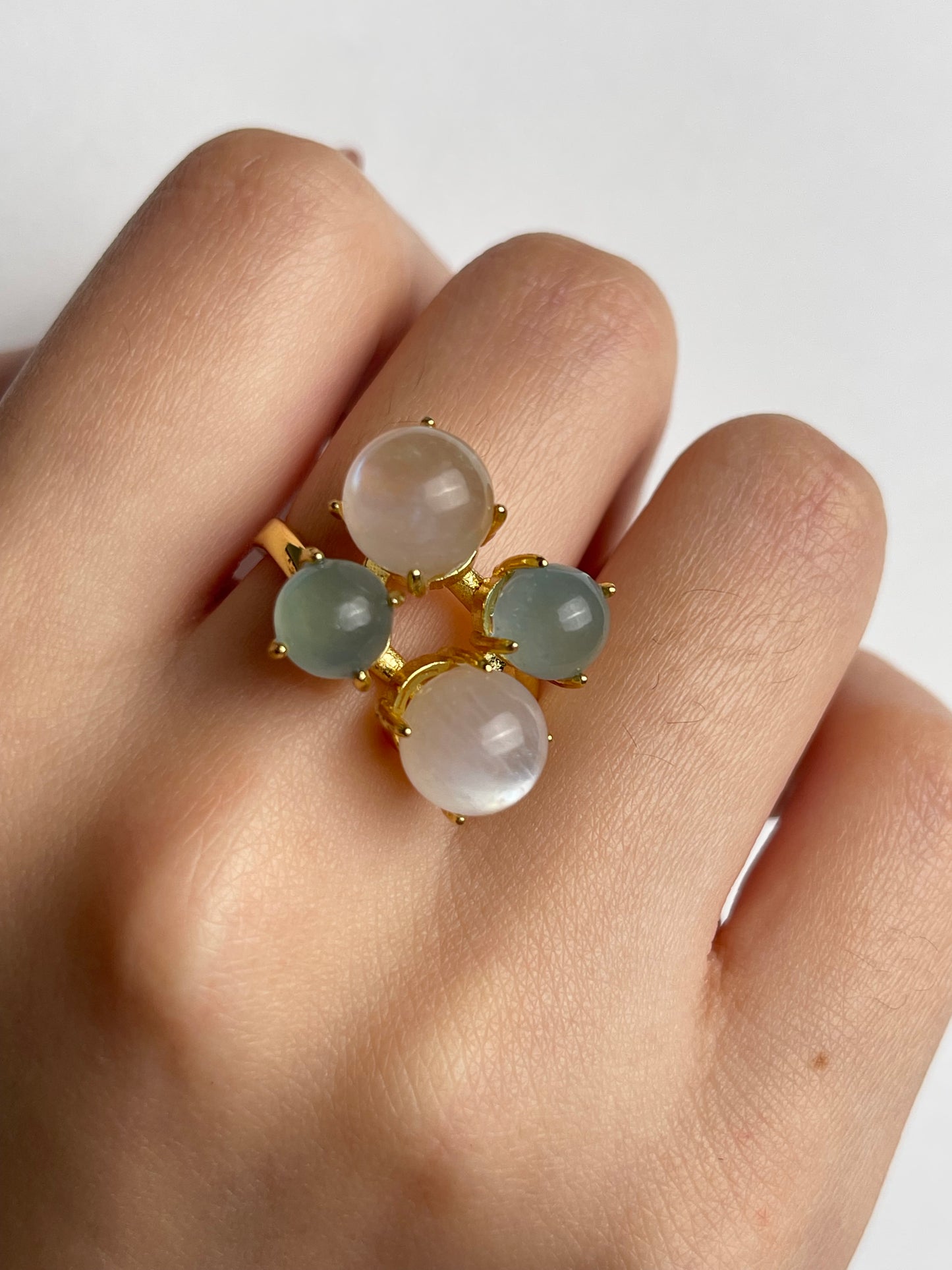 Close-up aquamarine and moonstone gemstone ring