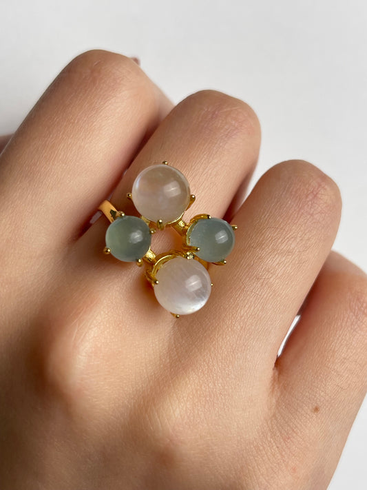 Close-up aquamarine and moonstone gemstone ring