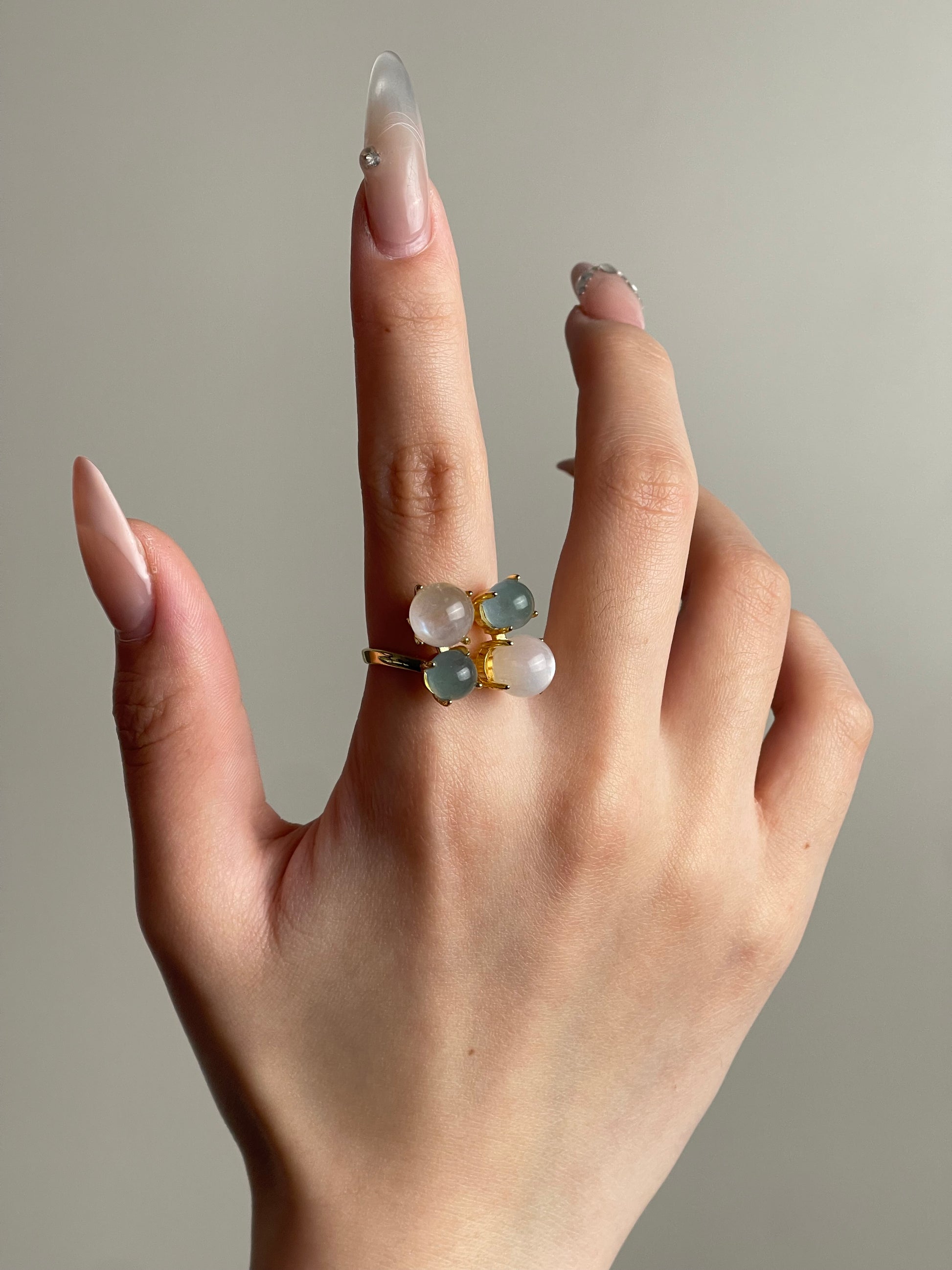 Close-up aquamarine and moonstone gemstone ring