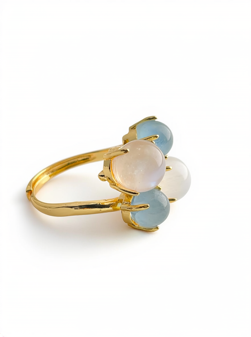 Side view of aquamarine and moonstone ring