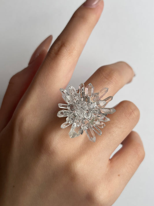 Close-up hand shot of Herkimer Diamond Quartz and Lemurian Quartz Flower Ring showing crystal details