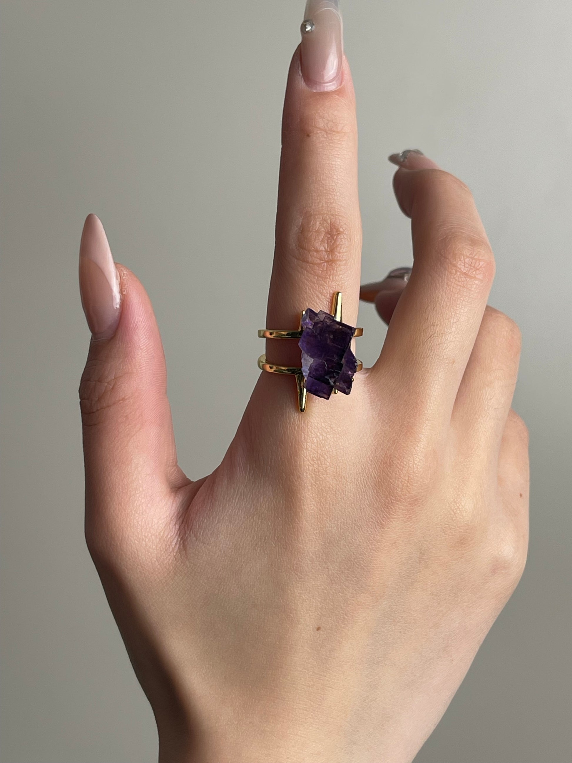 purple cubic fluorite crystal ring worn on hand