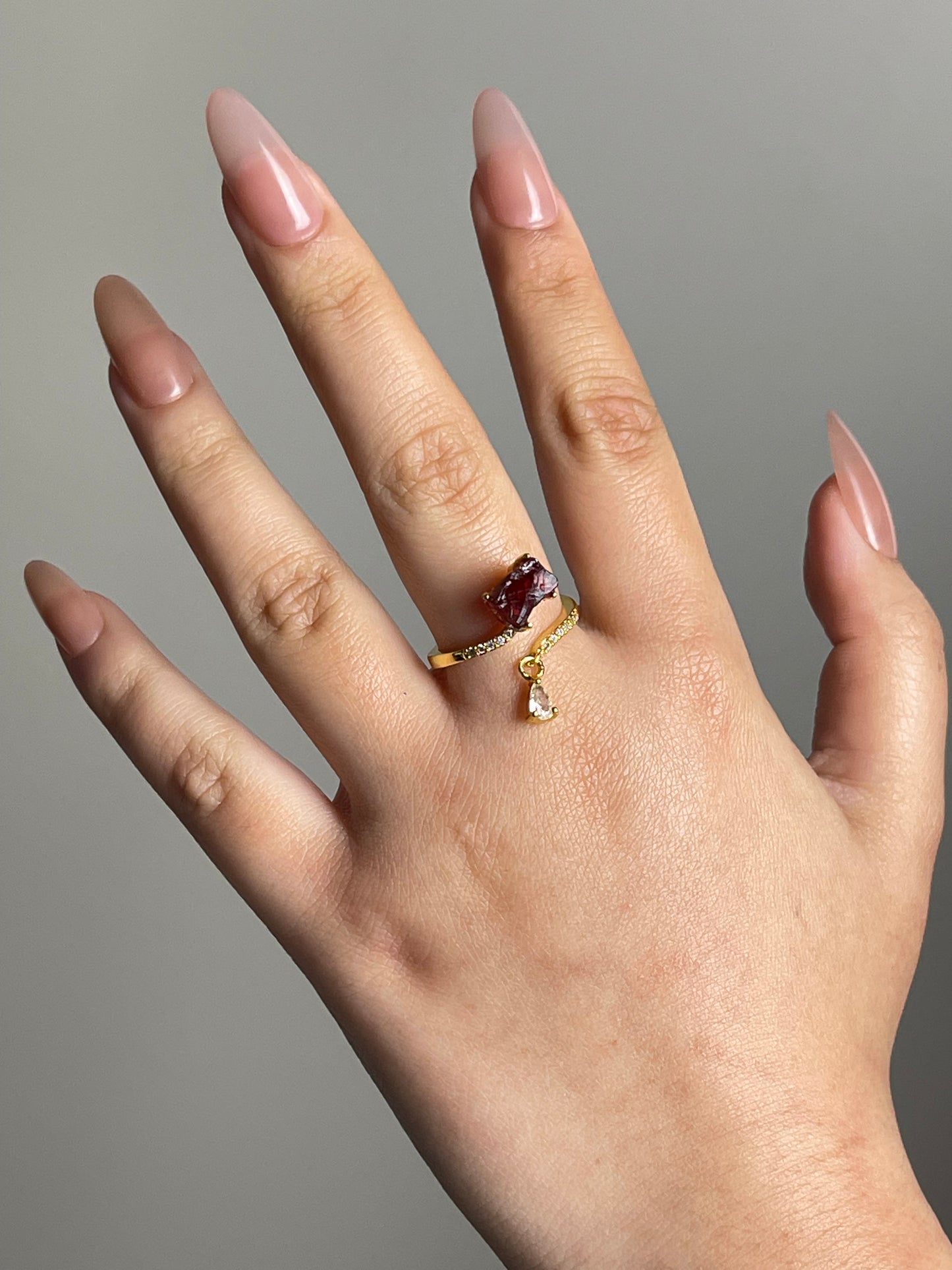 natural garnet crystal ring on hand jewelry styling
