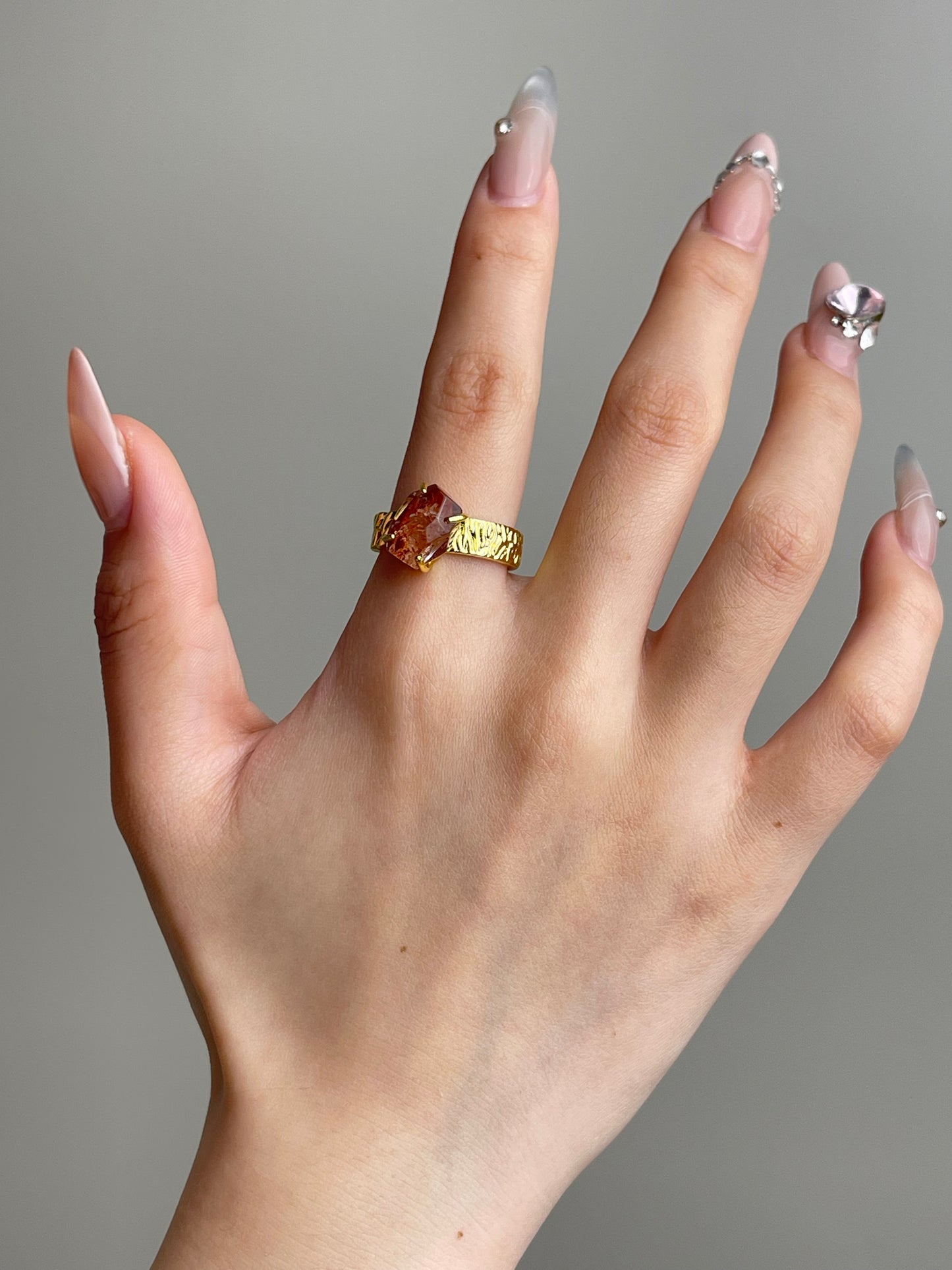 Red Hematoid Quartz Ring worn on hand featuring natural Fire Quartz crystal