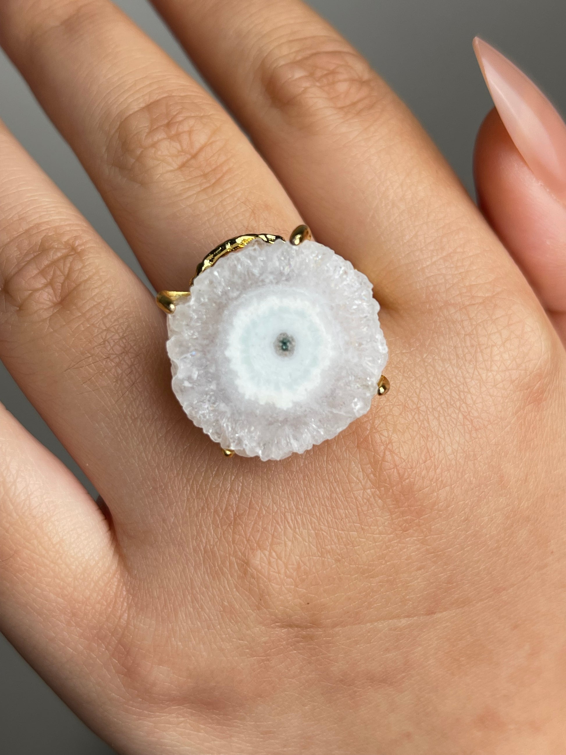 oryssia solar quartz crystal slice ring on hand
