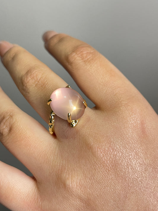 Close-up hand shot of Star Rose Quartz Ring with visible six-ray star