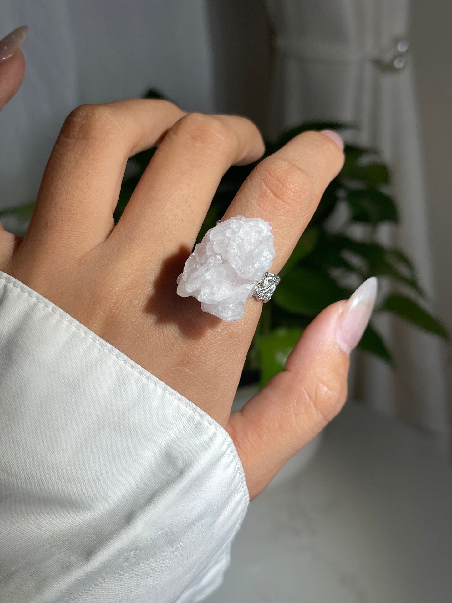 Close-up hand shot of Strawberry Quartz Crystal Ring showing natural pink quartz structure