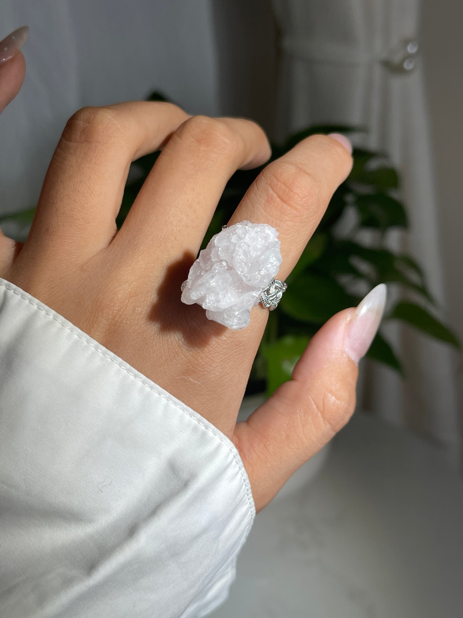 Close-up hand shot of Strawberry Quartz Crystal Ring showing natural pink quartz structure