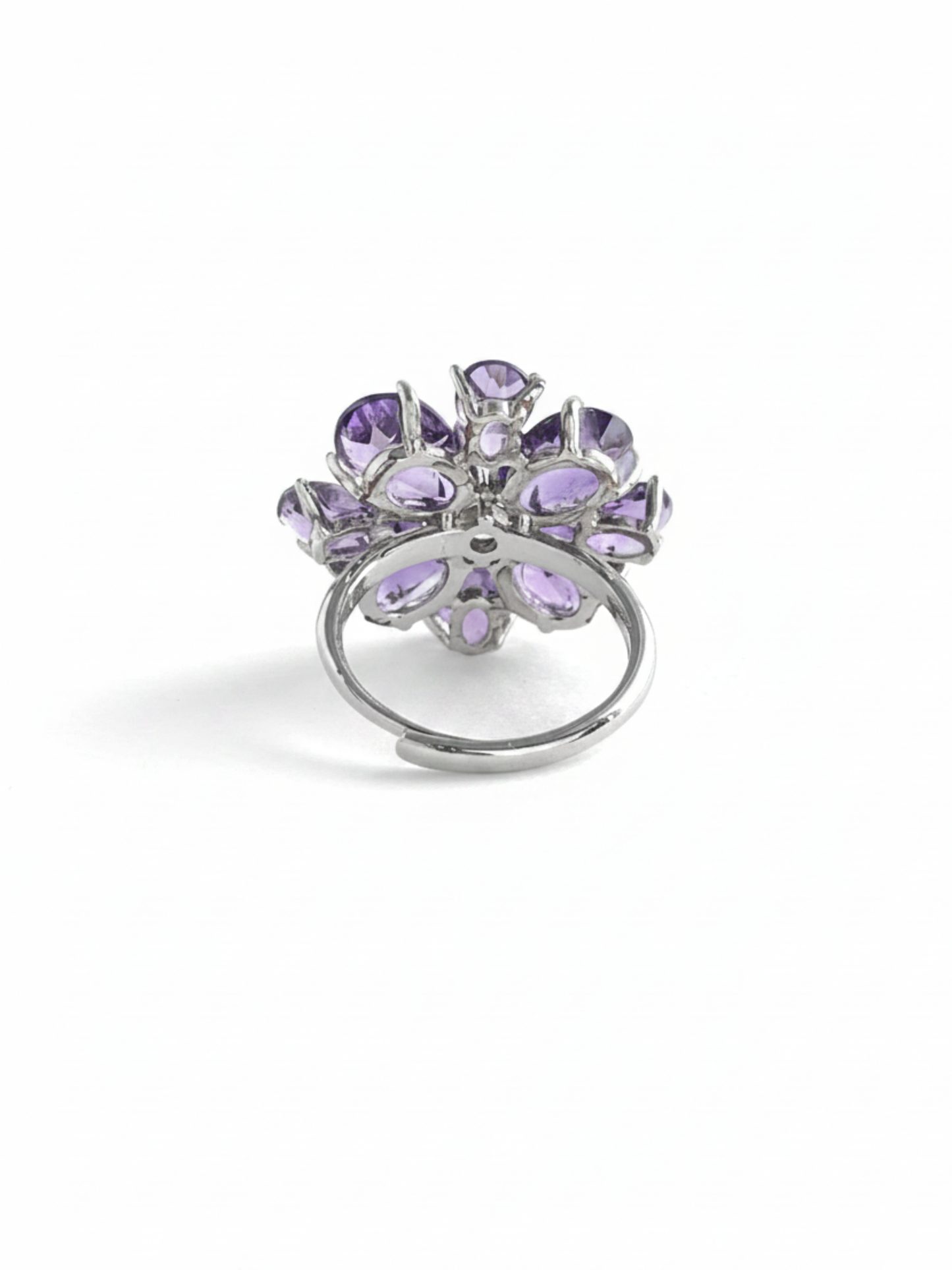 Back view of pear-cut amethyst snowflake ring with adjustable open band and silver-tone finish