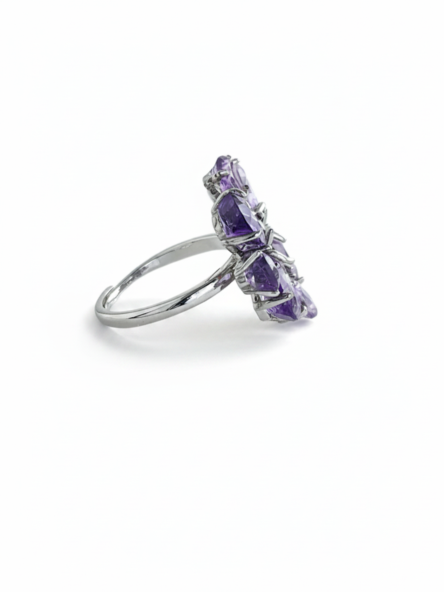 Side view of pear-cut amethyst snowflake ring showing faceted purple amethyst stones and silver-tone band