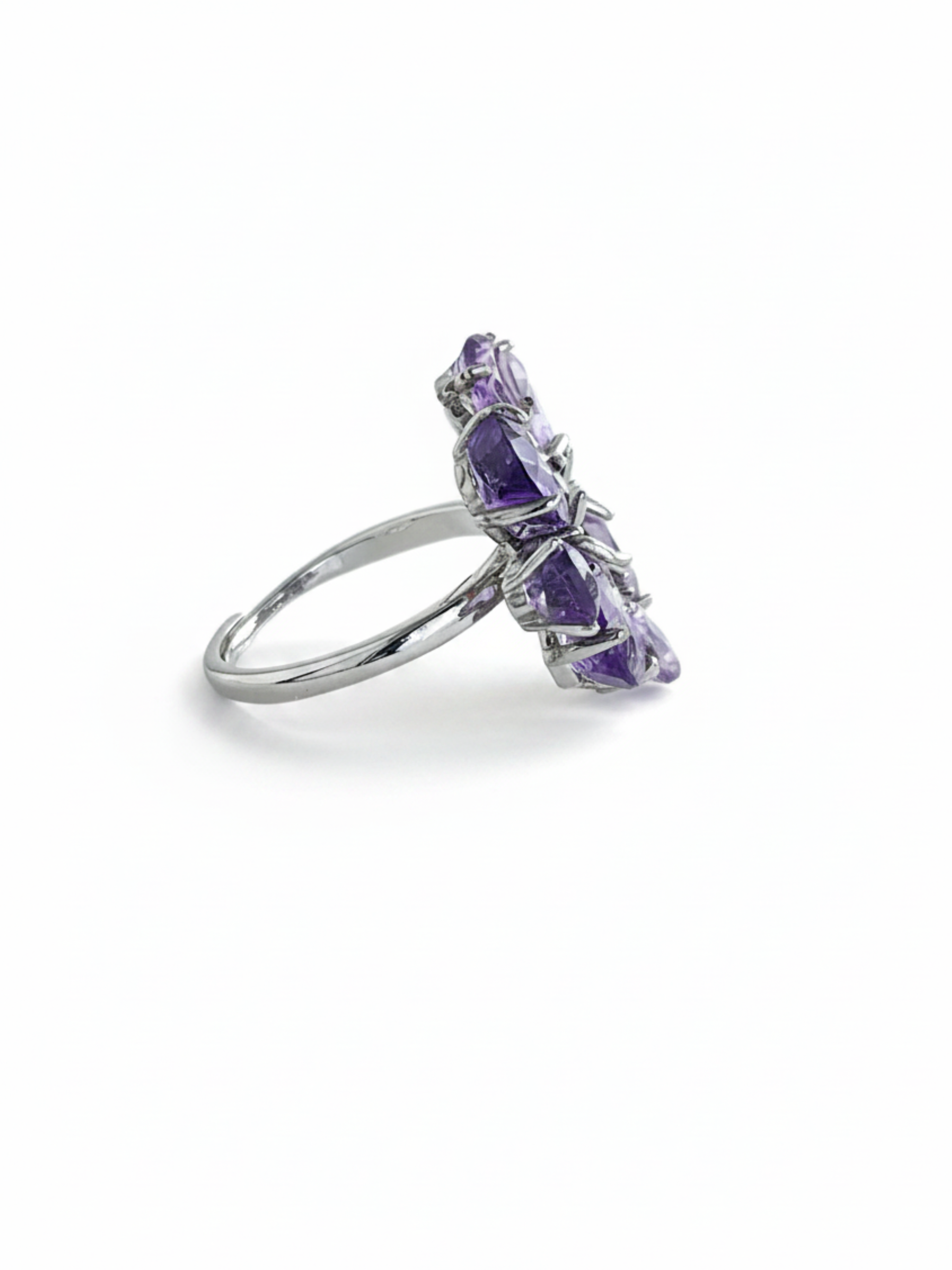 Side view of pear-cut amethyst snowflake ring showing faceted purple amethyst stones and silver-tone band