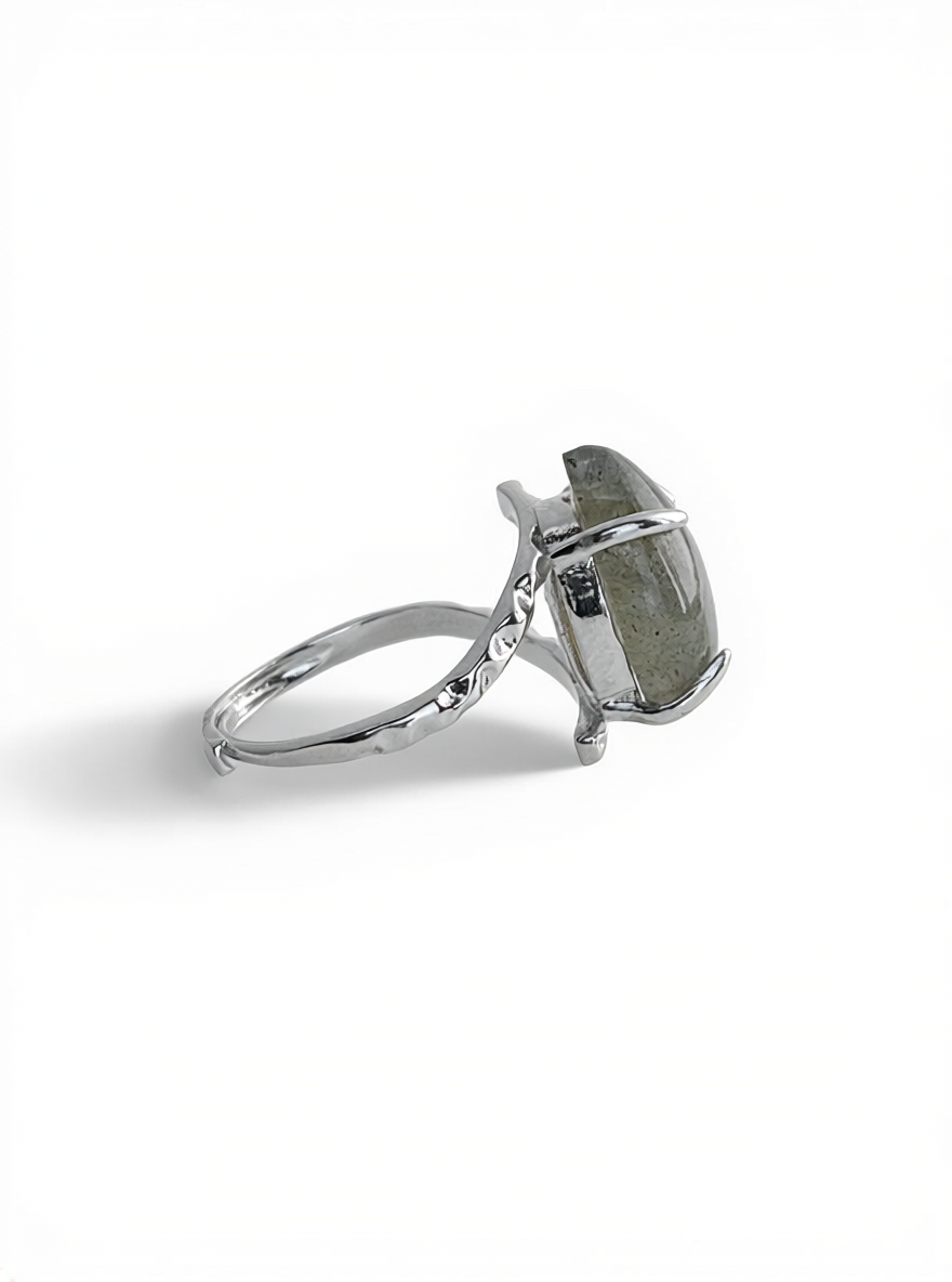 Side view of pear cut Labradorite ring from India in silver tone open band setting