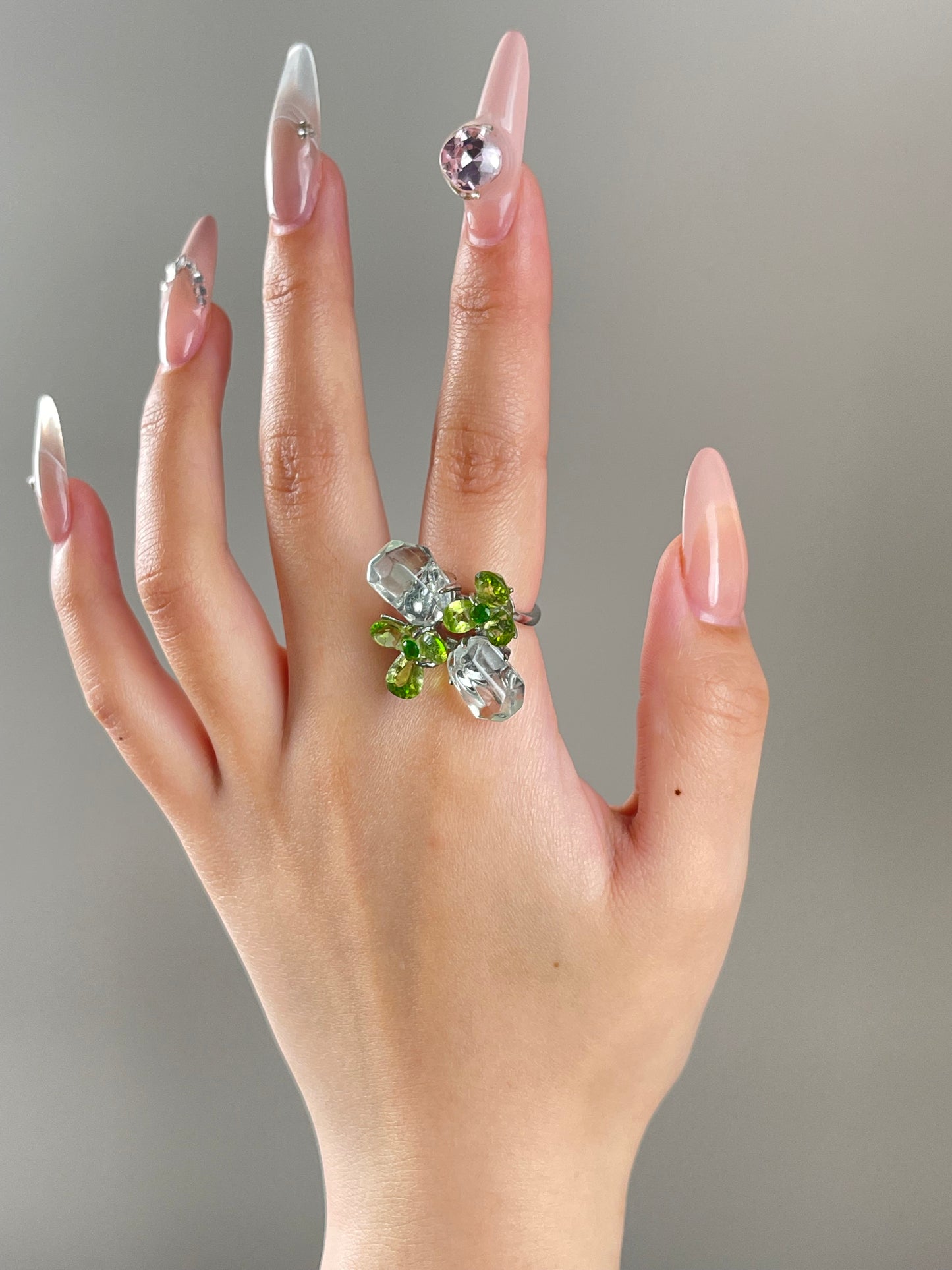 peridot bloom ring worn on hand