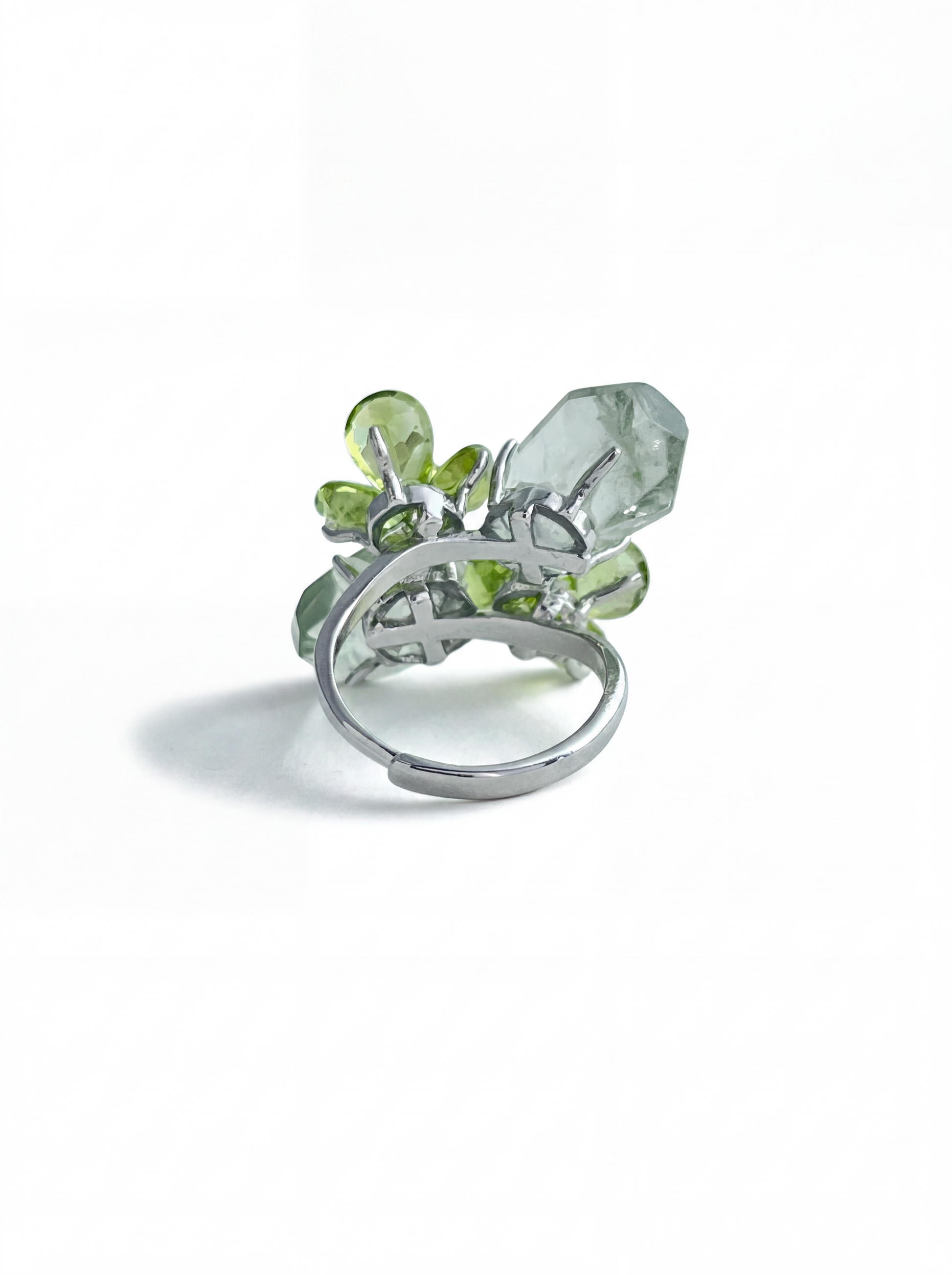 Back view of adjustable peridot and green quartz ring