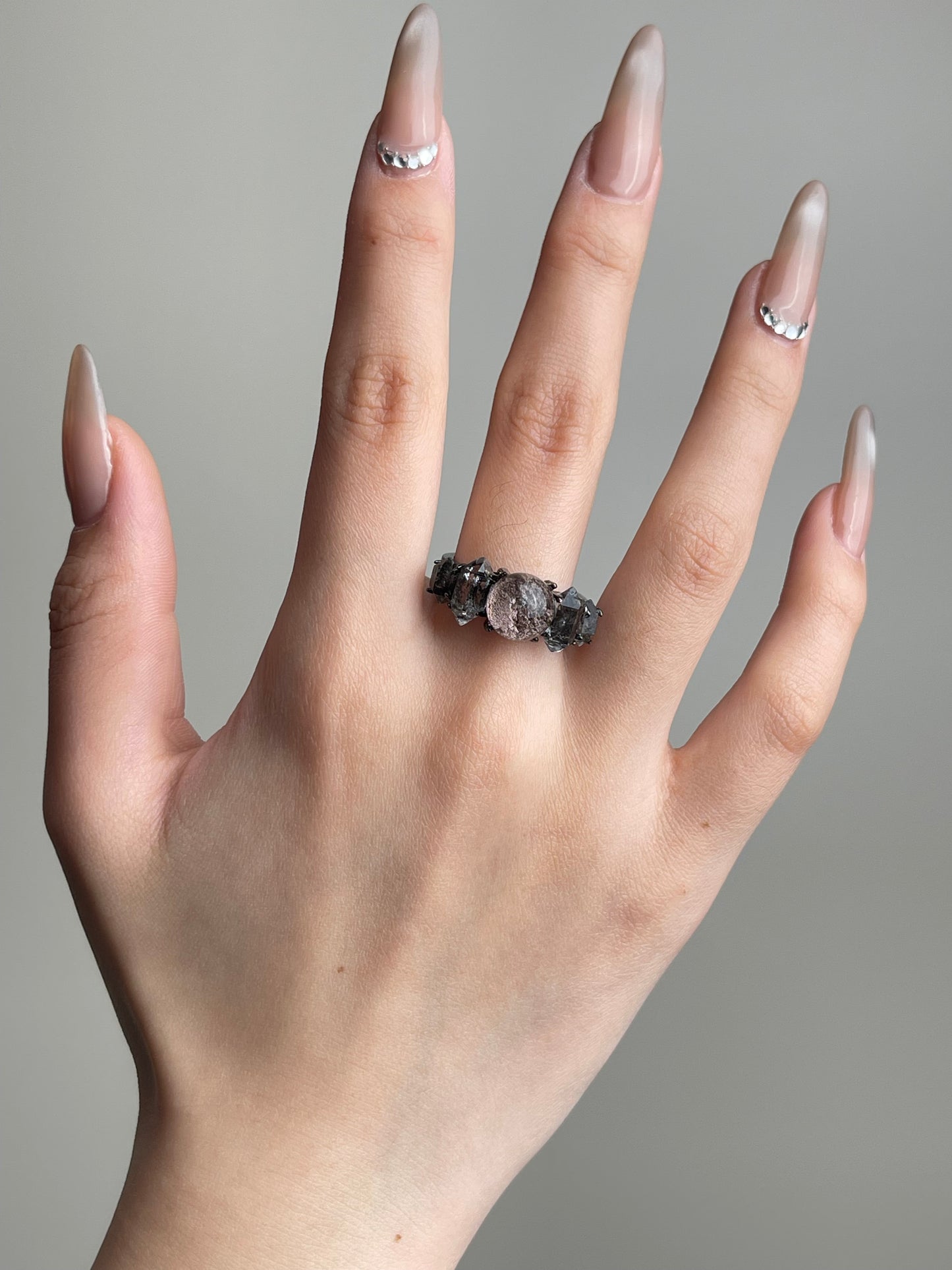 Phantom Quartz and Herkimer Diamond Quartz Ring worn on hand