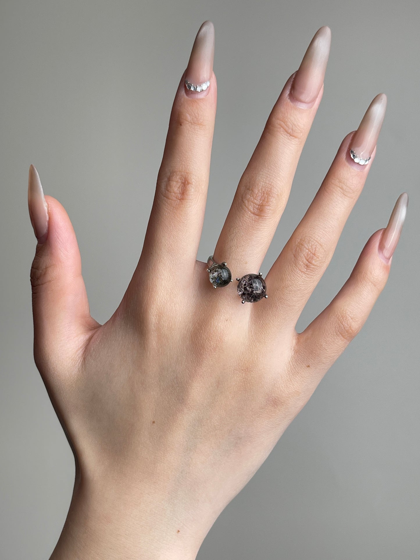 Phantom Quartz twin stone ring worn on hand