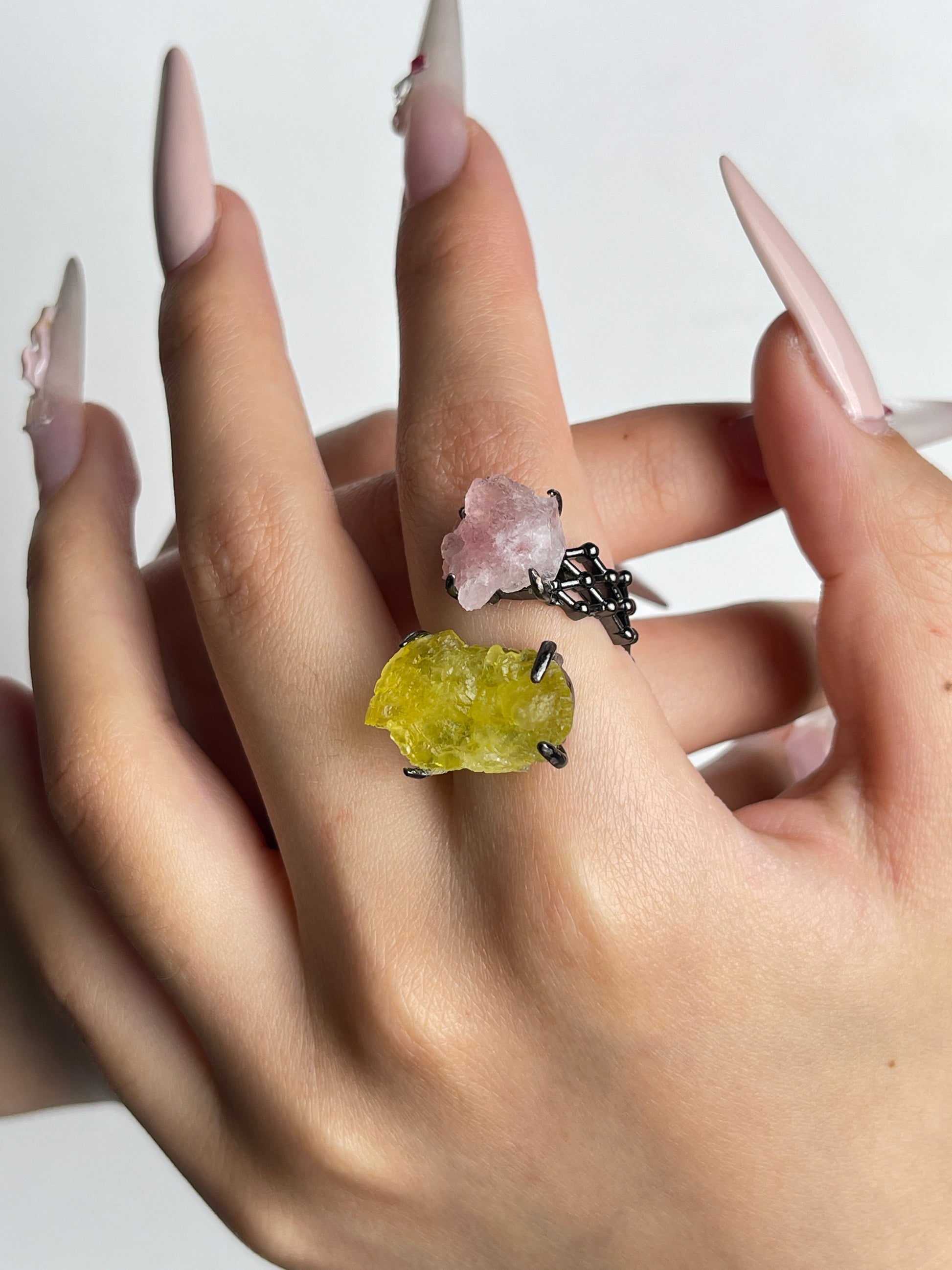 Pink Strawberry Quartz and Brucite crystal ring worn on hand