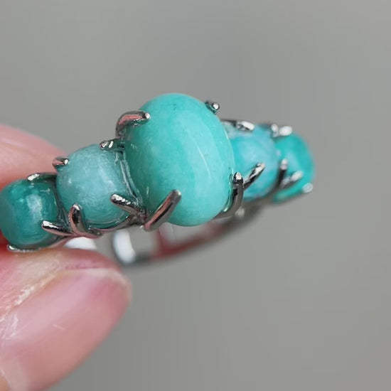 Video of amazonite band ring showing polished blue green stones and row setting